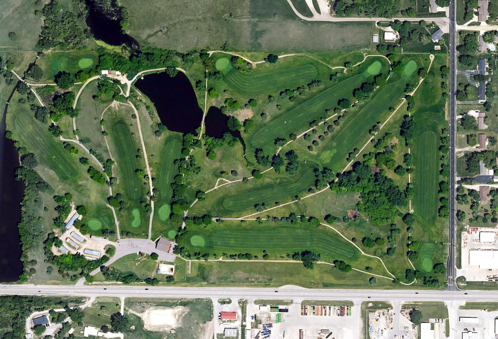 Aerial view of Marysville Country club, KS, with its hole routing marked