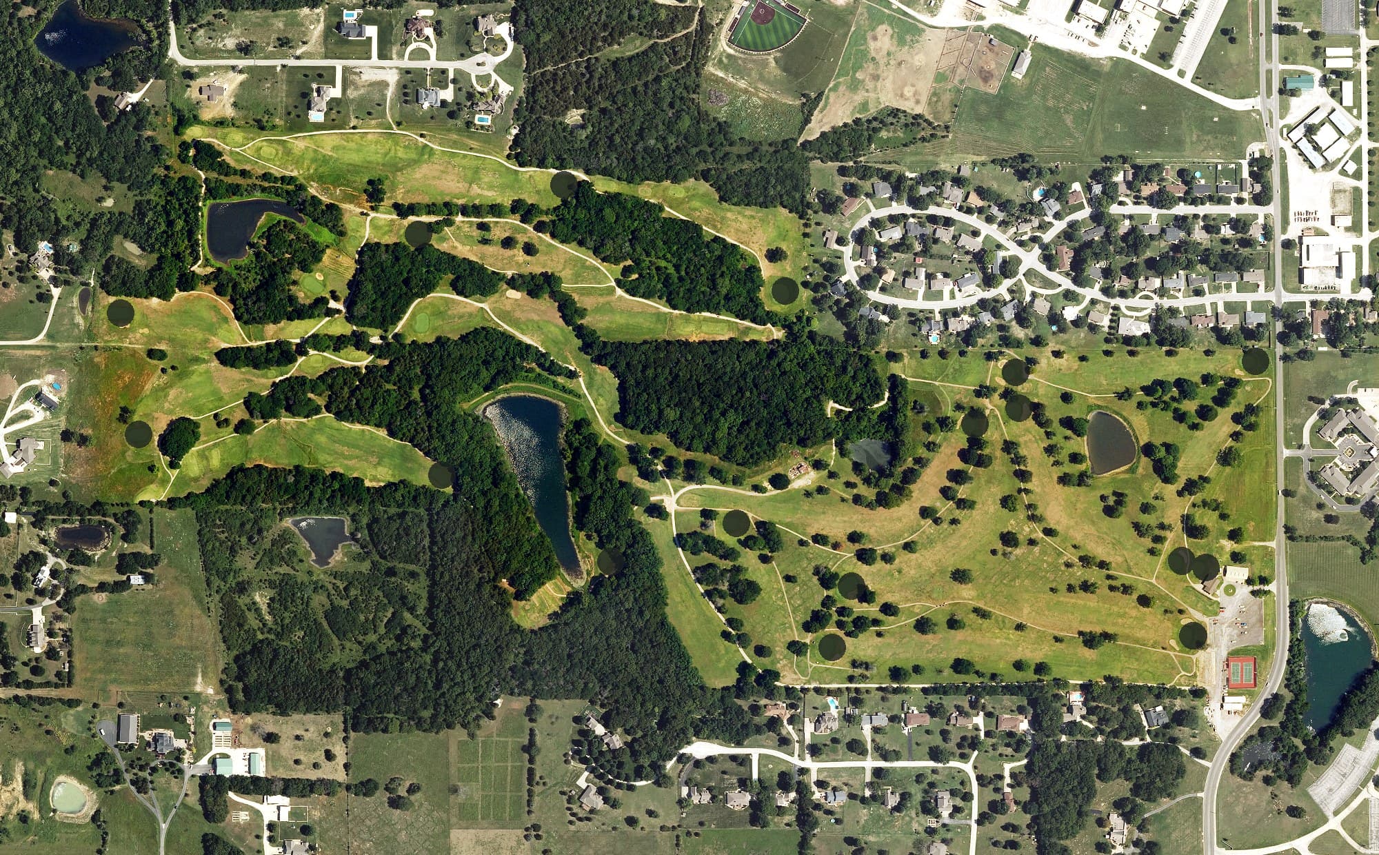 Aerial view of Woodland Hills Golf Course, KS, with its hole routing marked