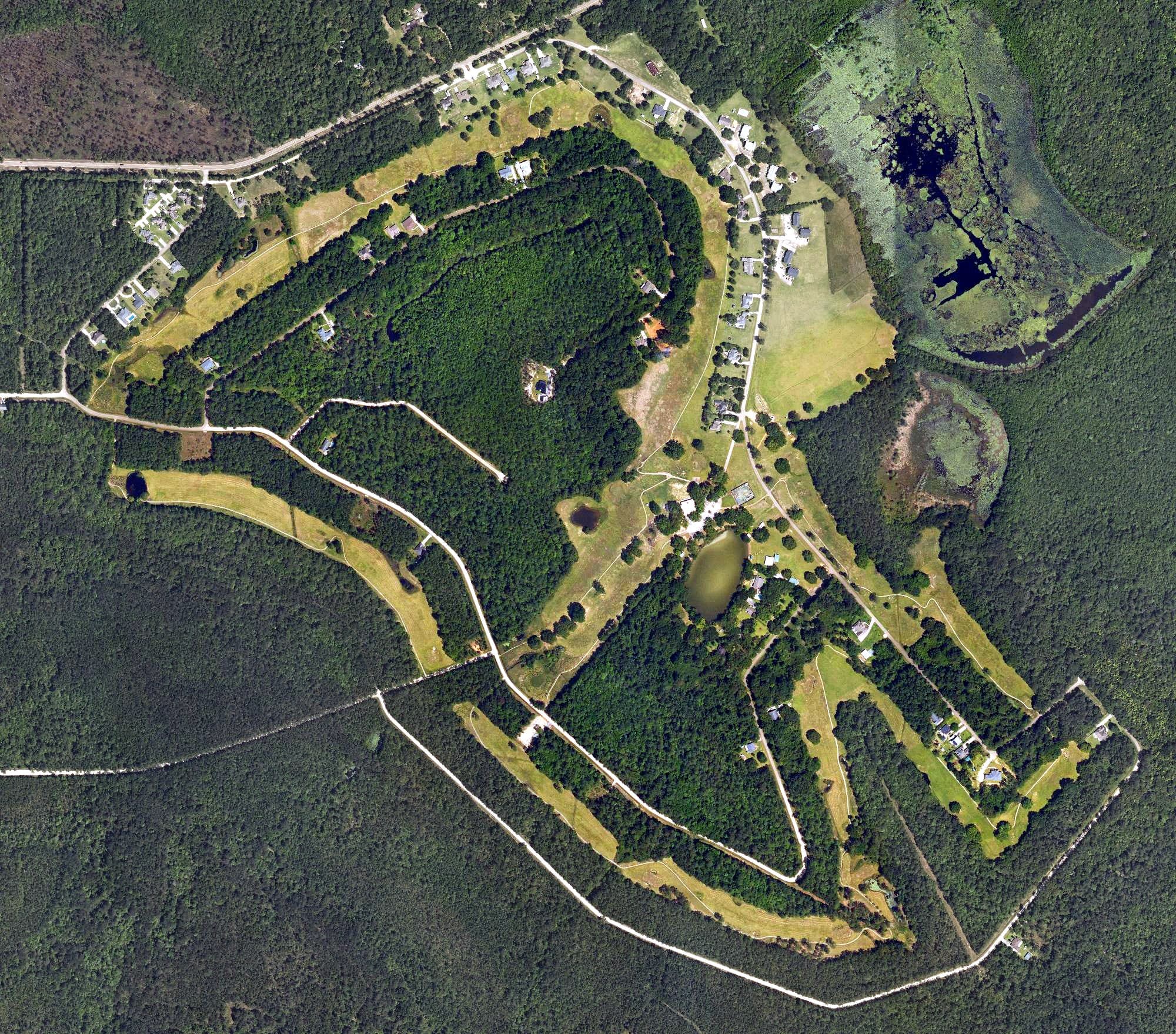 Aerial view of Abita Springs Golf Club, LA, with its hole routing marked