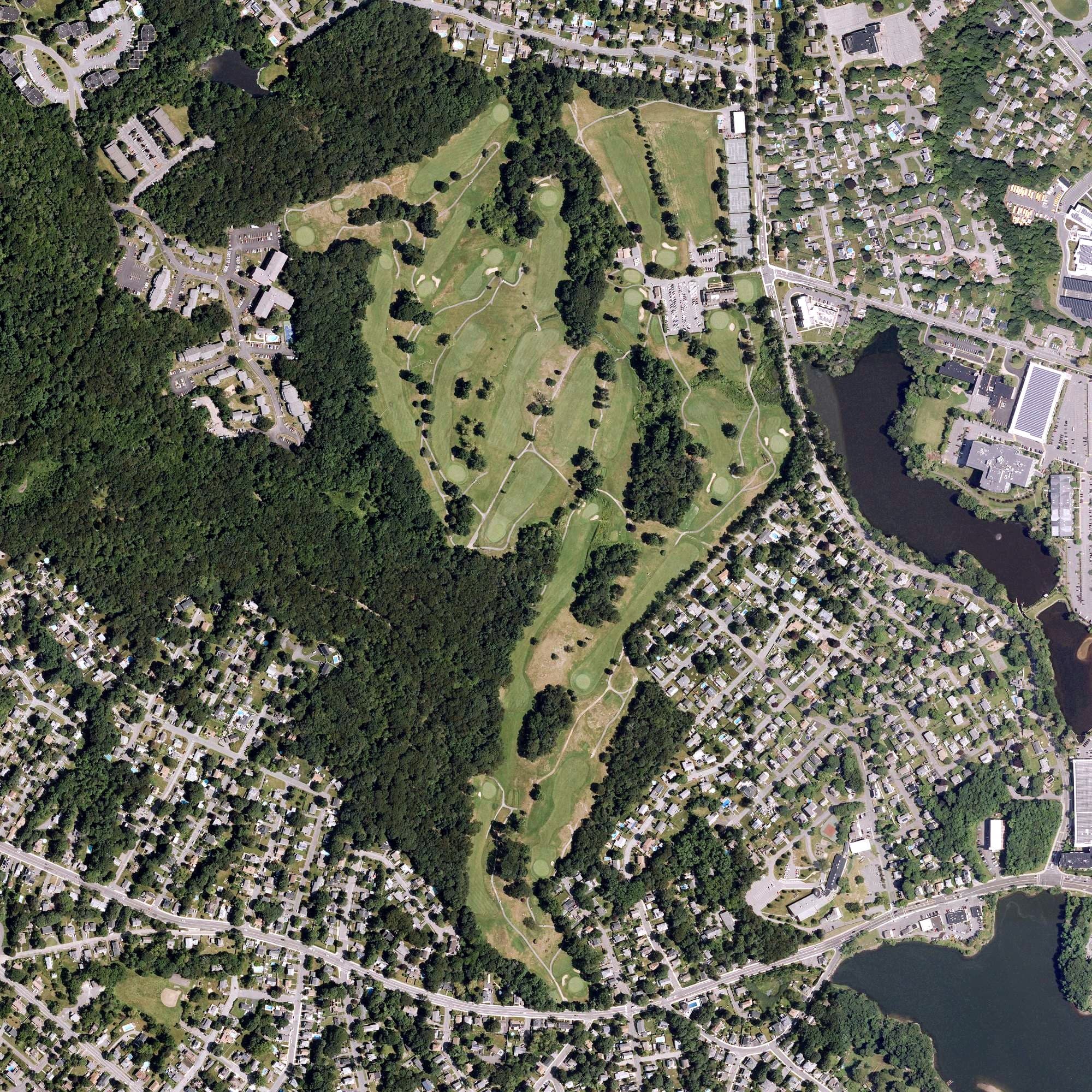 Aerial view of Beverly Golf & Tennis Club, MA, with its hole routing marked