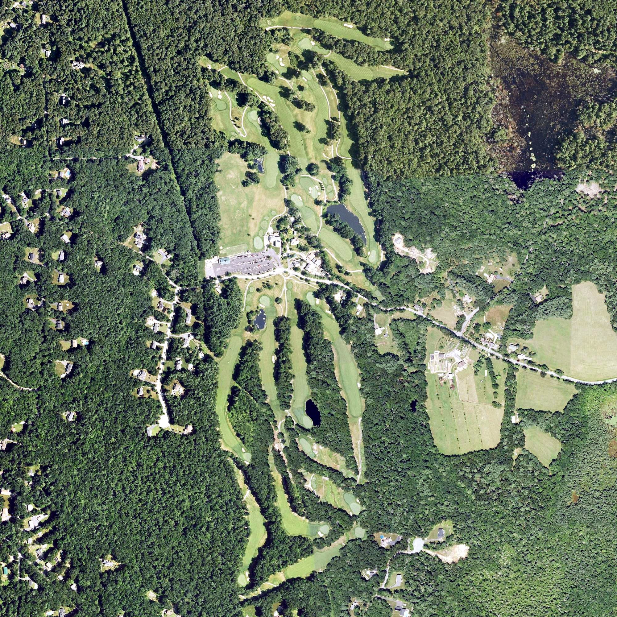 Aerial view of Blissful Meadows Golf Club, MA, with its hole routing marked