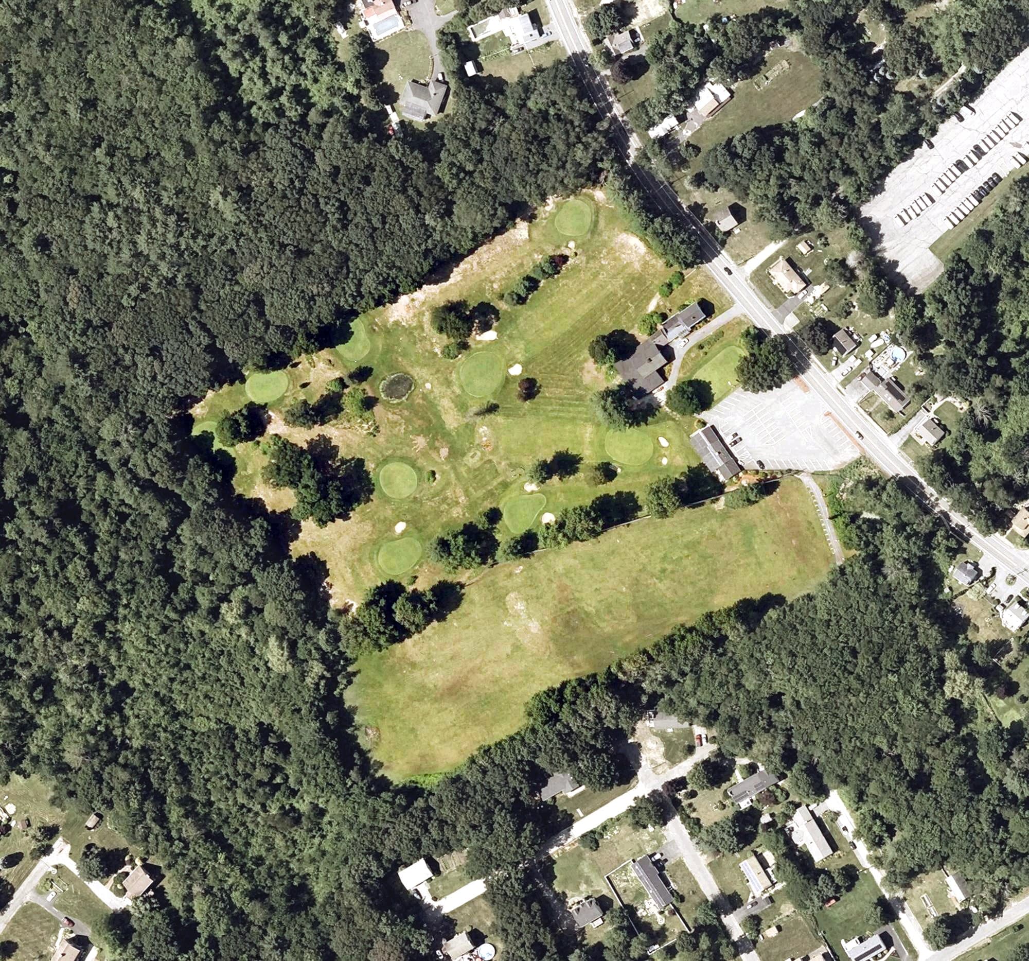 Aerial view of Garrison Par 3 Golf Center, MA, with its hole routing marked