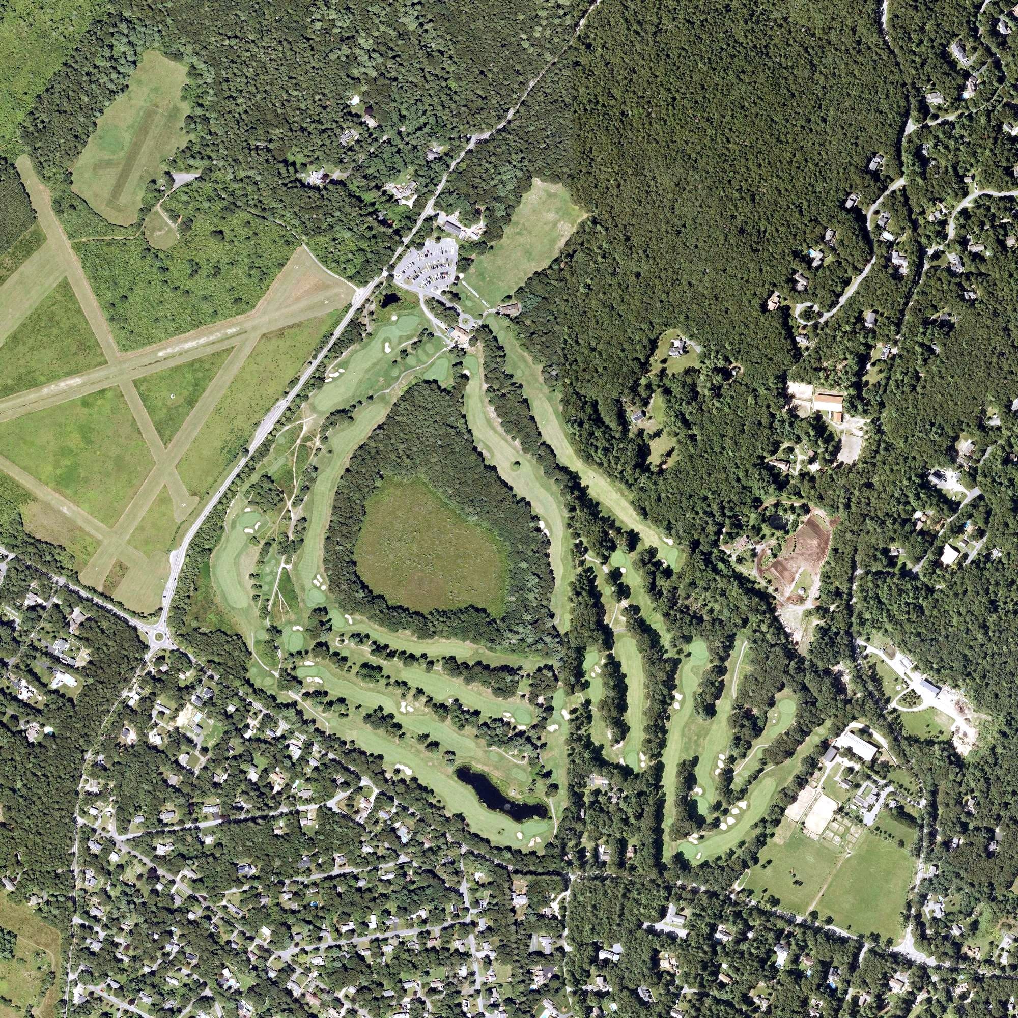 Aerial view of Olde Barnstable Fairgrounds Golf Course, MA, with its hole routing marked