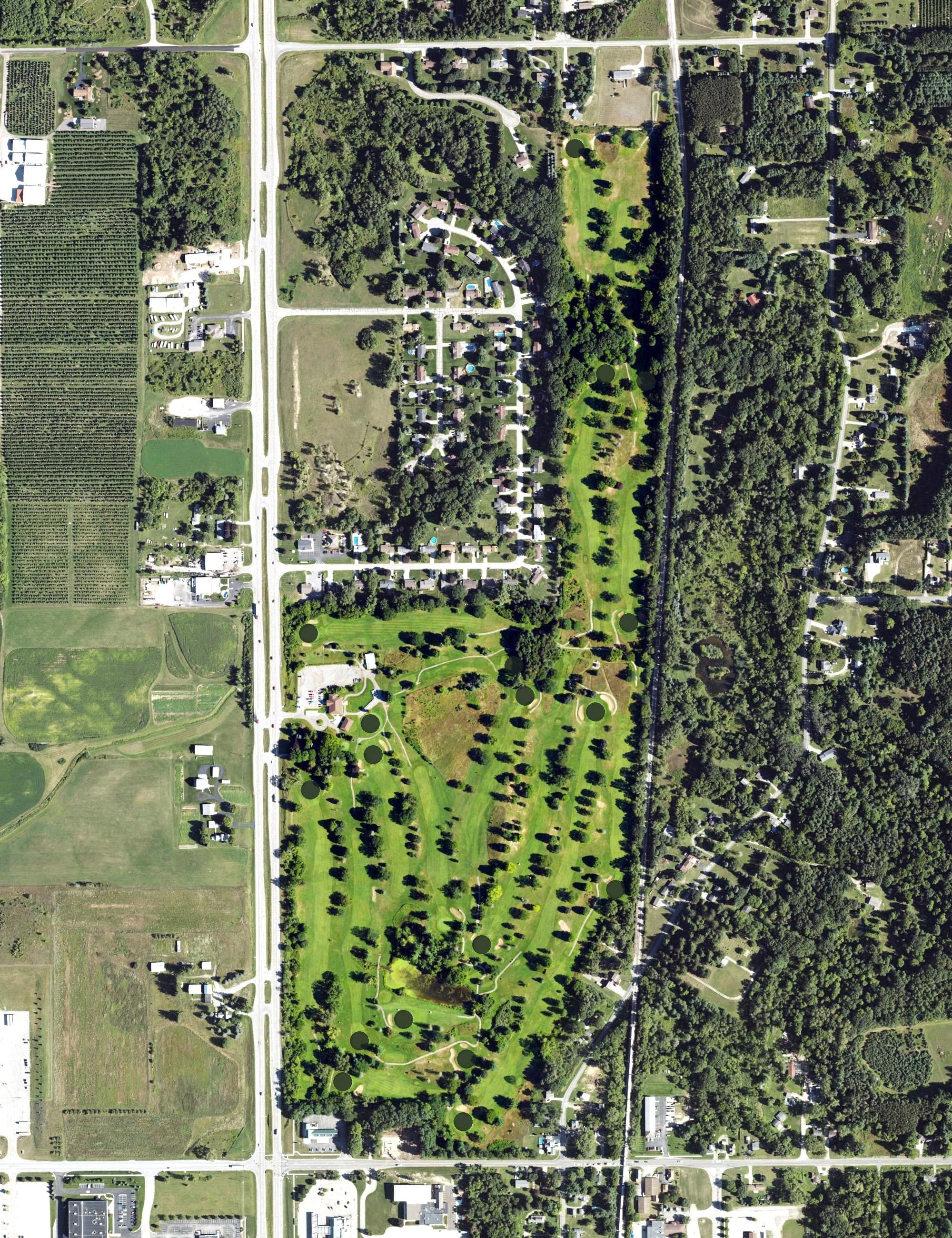 Aerial view of Alpine Golf Club, MI, with its hole routing marked