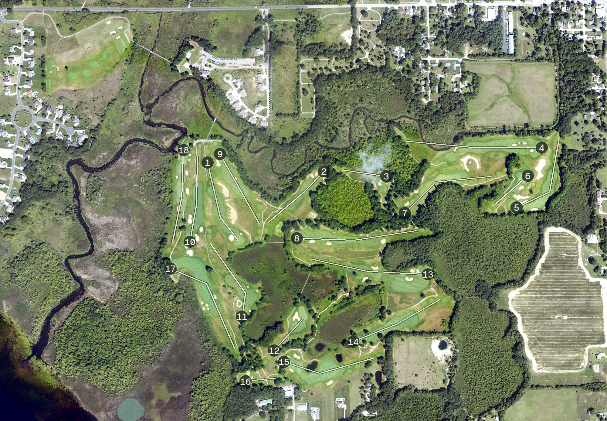 Aerial view of Angels Crossing Golf Course, MI, with its hole routing marked