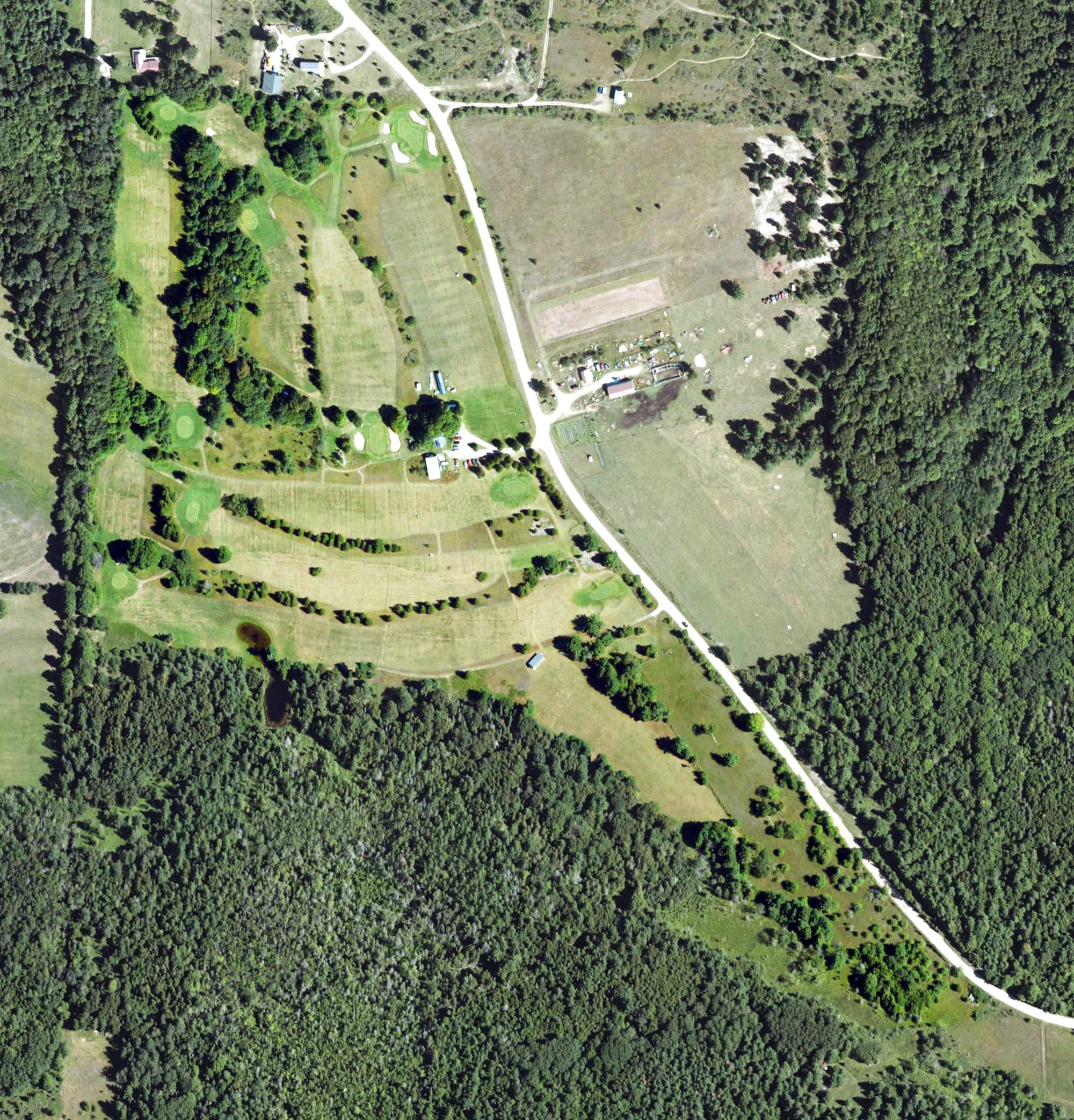 Aerial view of Beaver Island Golf Course, MI, with its hole routing marked
