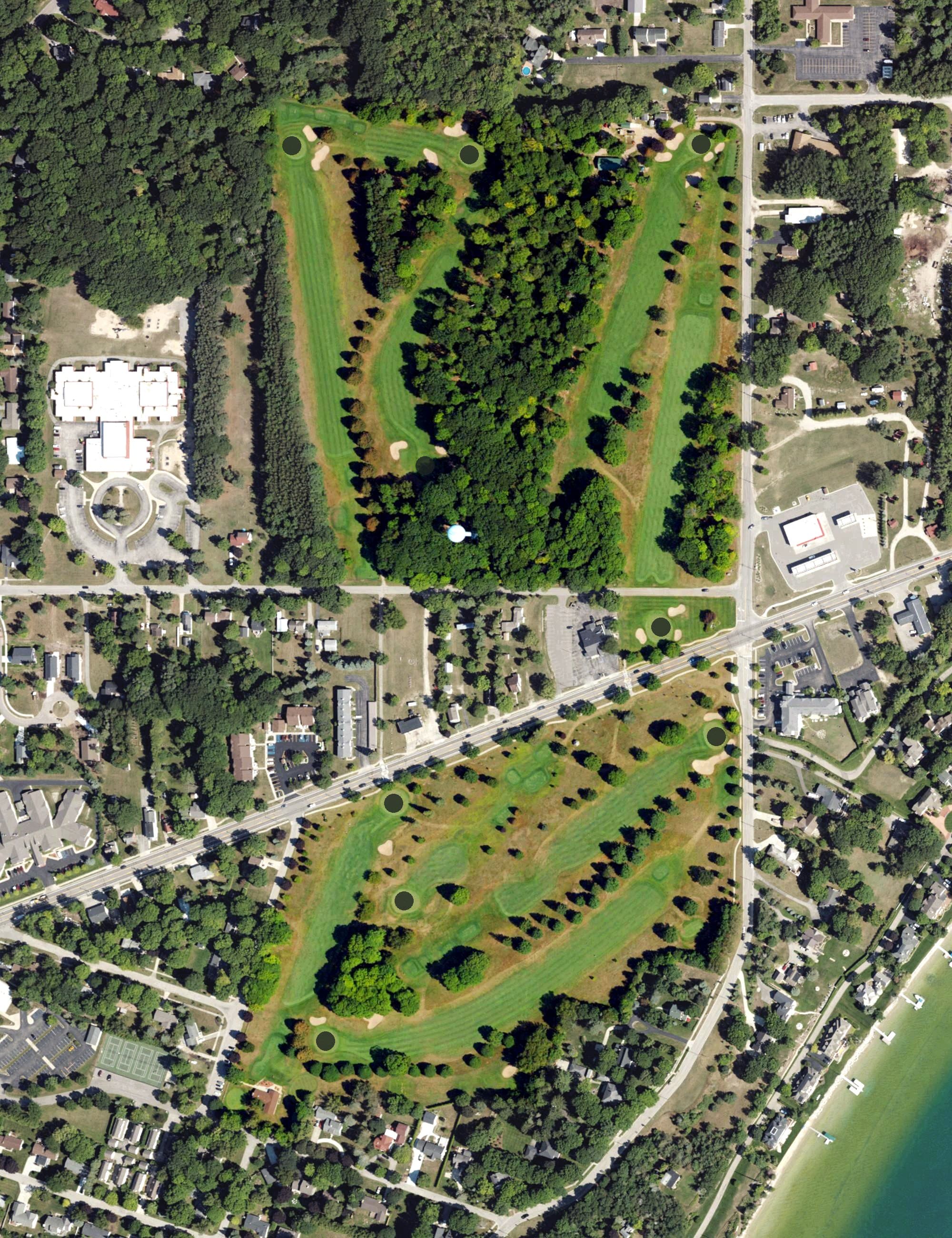 Aerial view of Charlevoix Municipal Golf Course, MI, with its hole routing marked