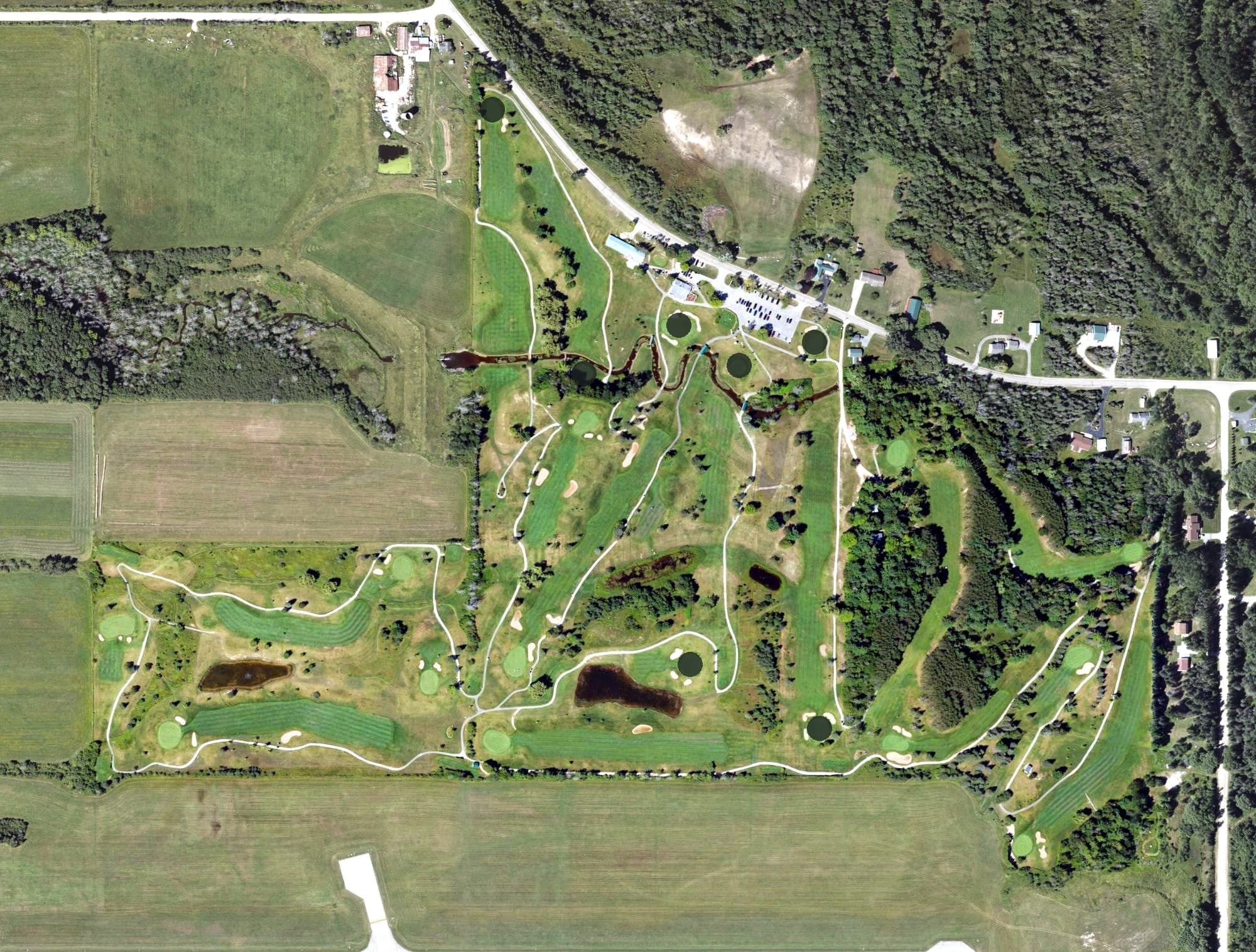 Aerial view of Cheboygan Golf & Country Club, MI, with its hole routing marked
