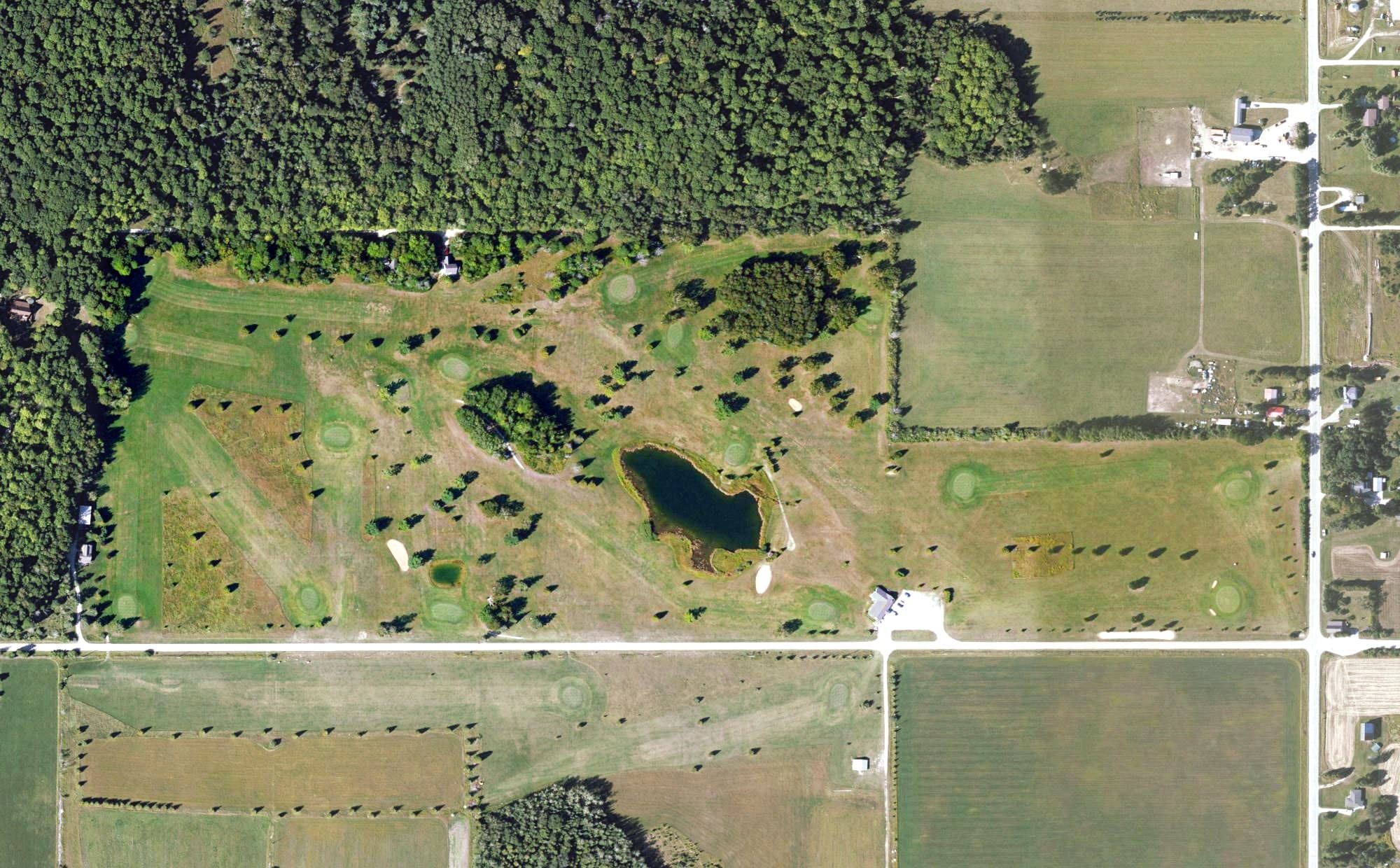 Aerial view of Garden Golf Club, MI, with its hole routing marked