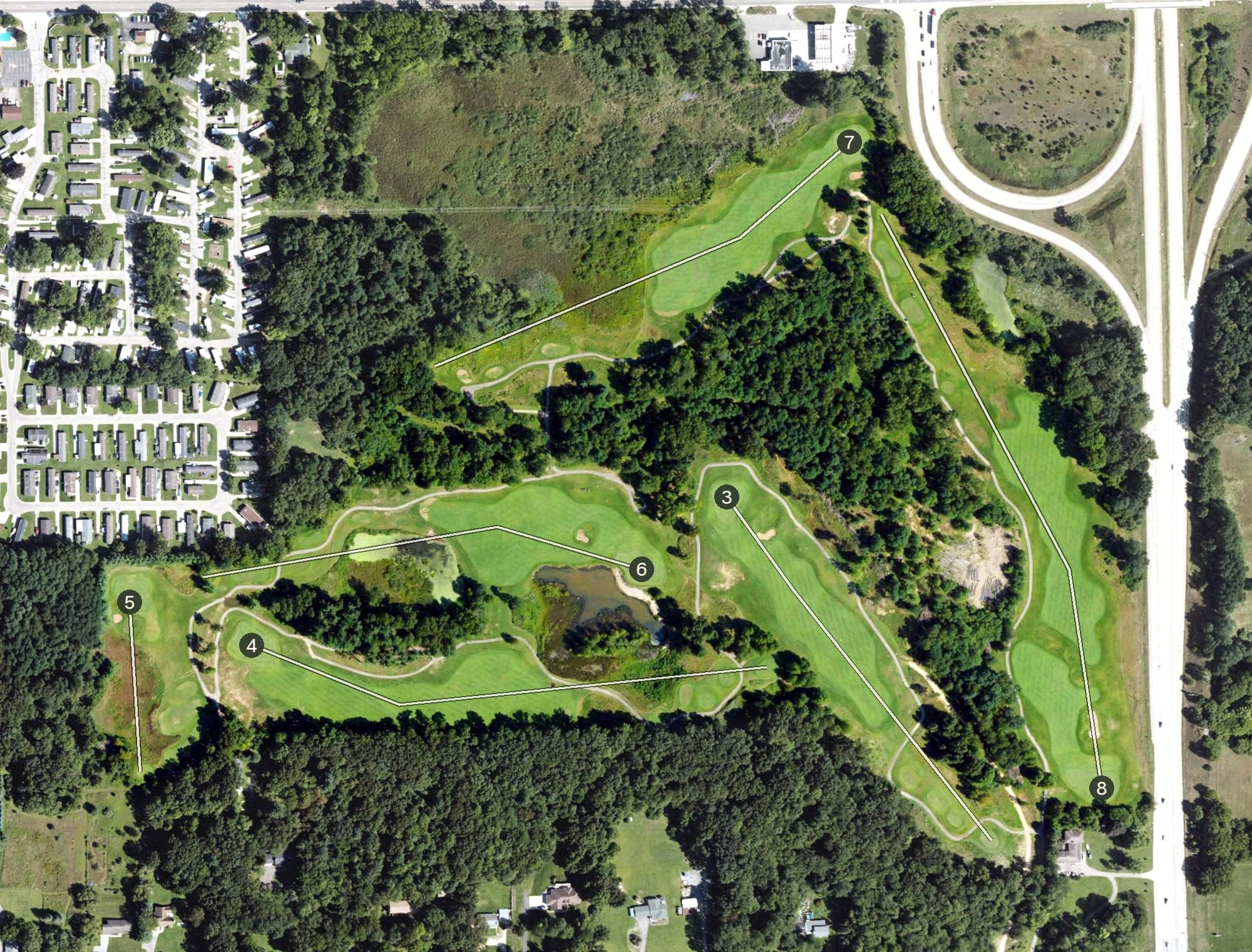 Aerial view of Grande Golf Club, MI, with its hole routing marked