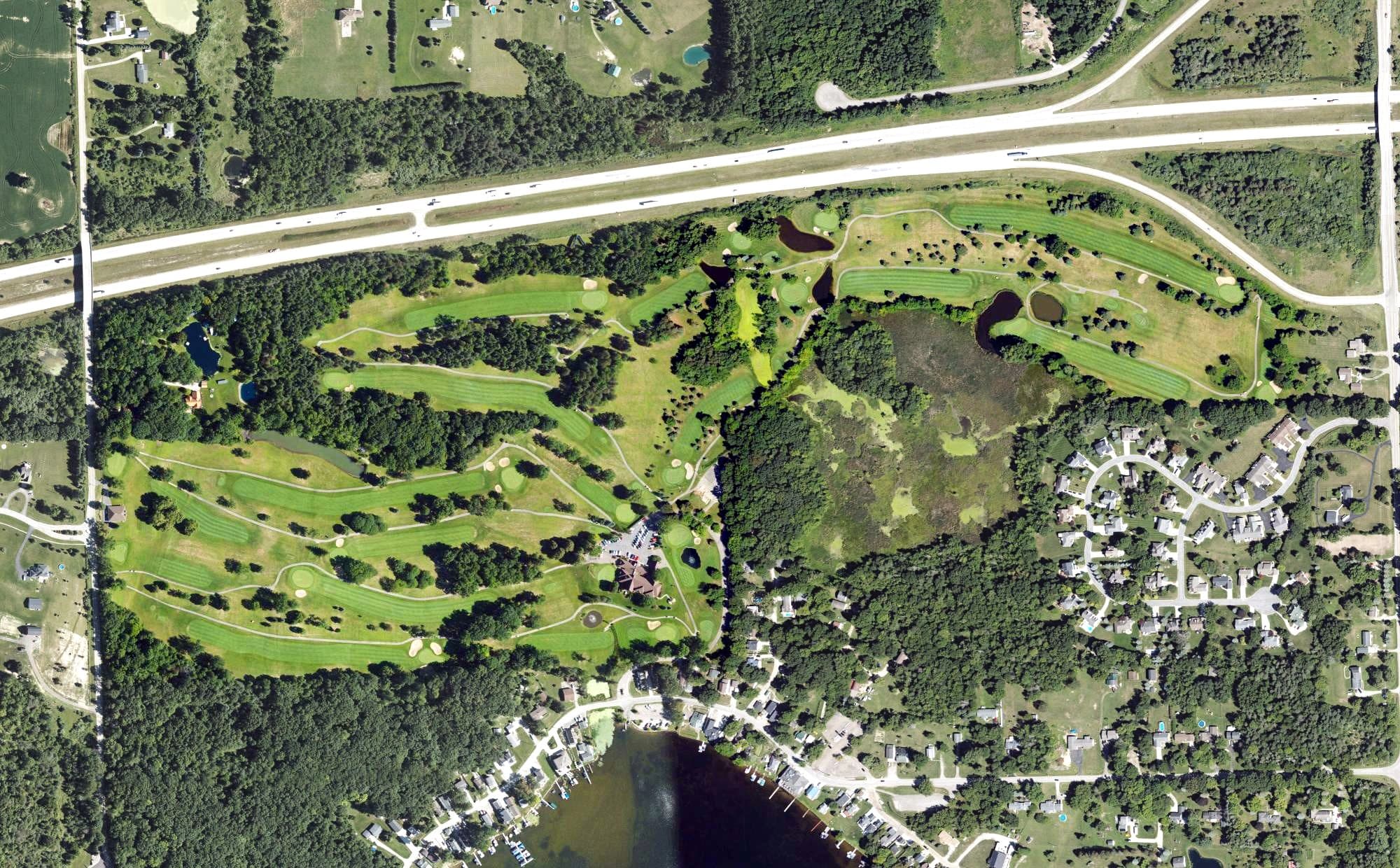 Aerial view of Lapeer Country Club, MI, with its hole routing marked