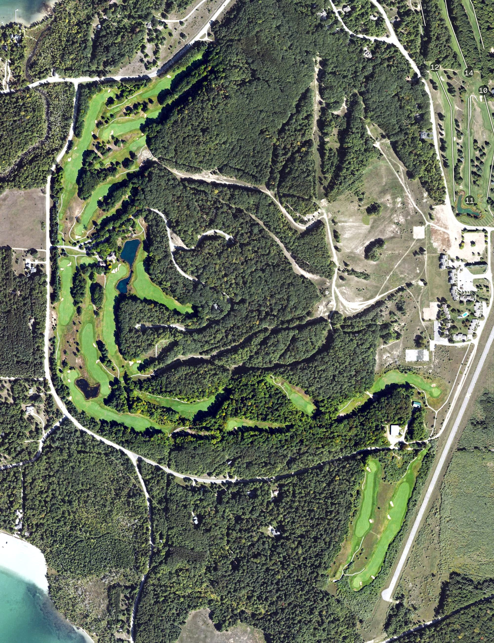 Aerial view of Manitou Passage Golf Club, MI, with its hole routing marked
