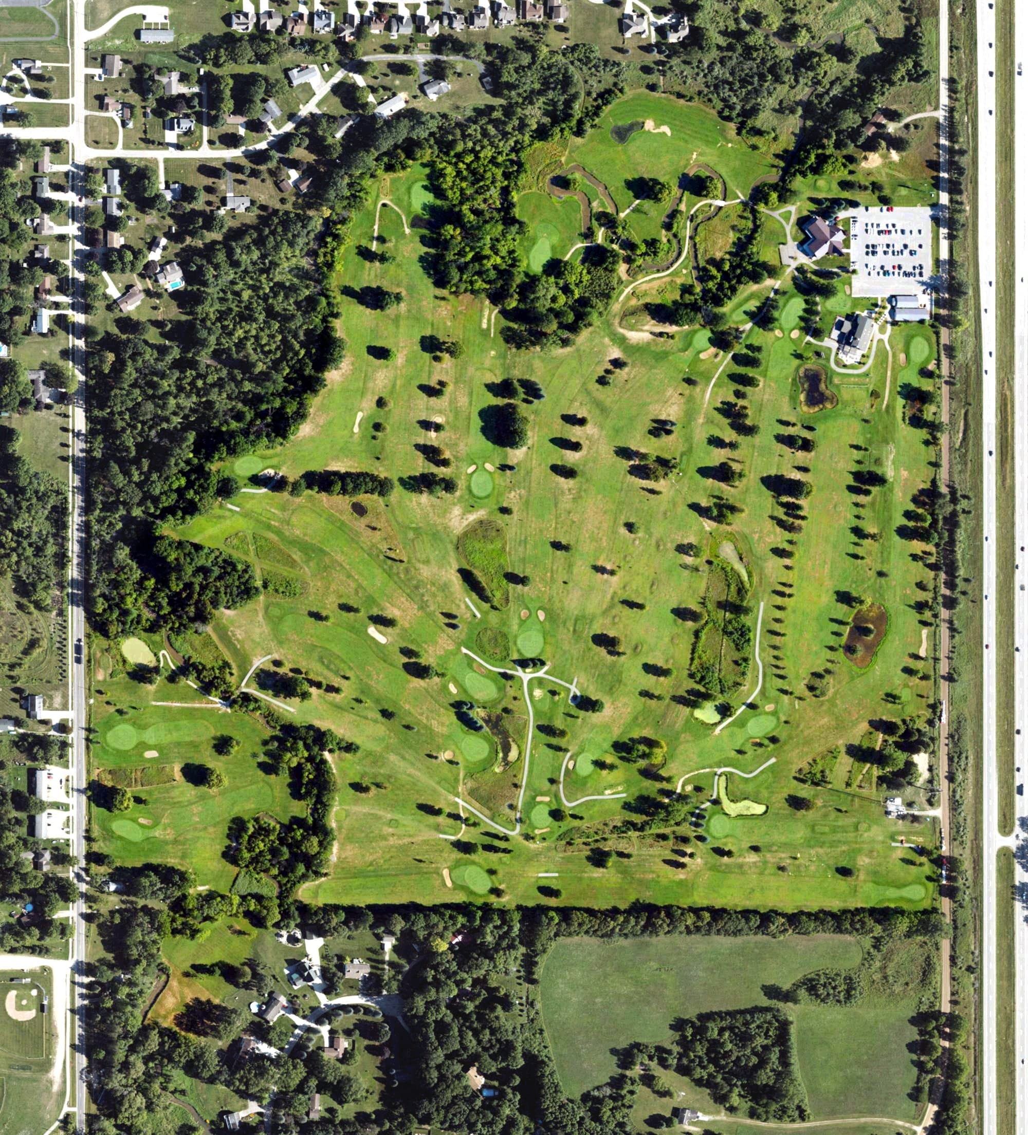 Aerial view of Maple Creek Golf Club, MI, with its hole routing marked