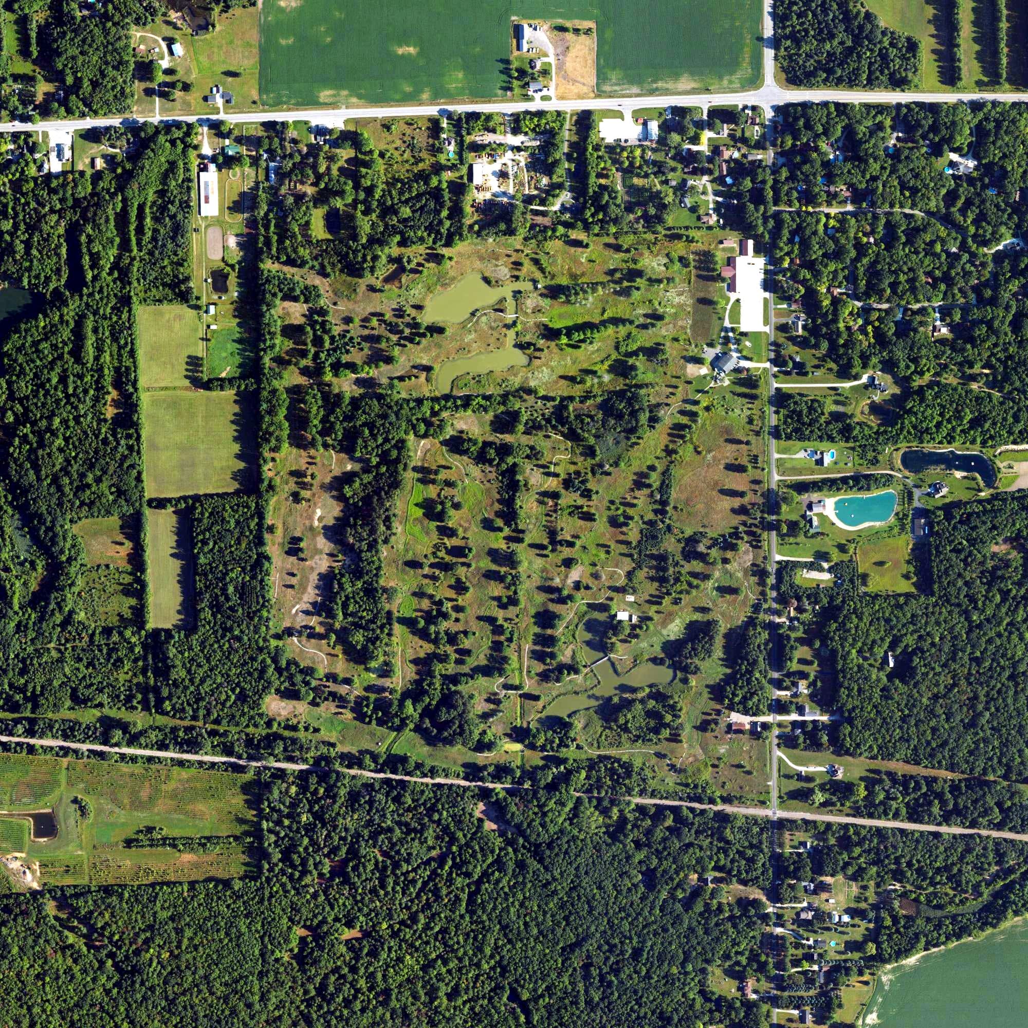 Aerial view of Maple Hill Golf Club, MI, with its hole routing marked