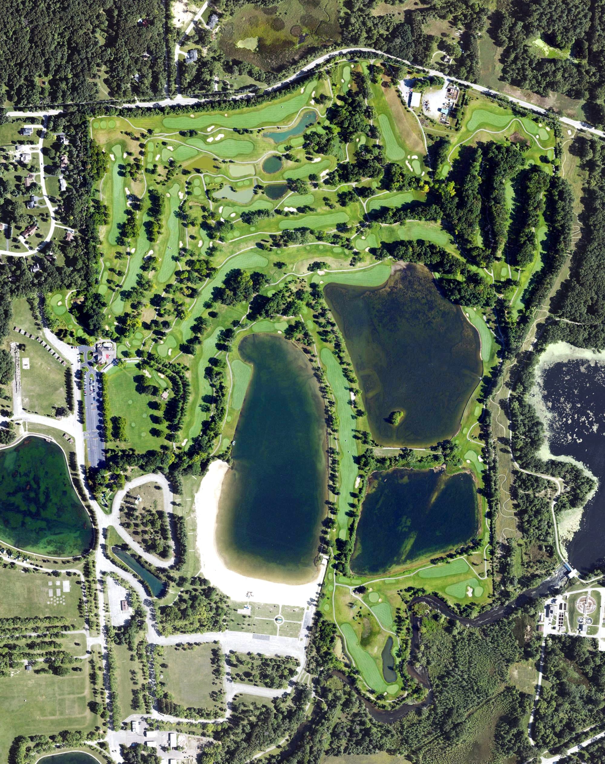Aerial view of Mystic Creek Golf Club, MI, with its hole routing marked