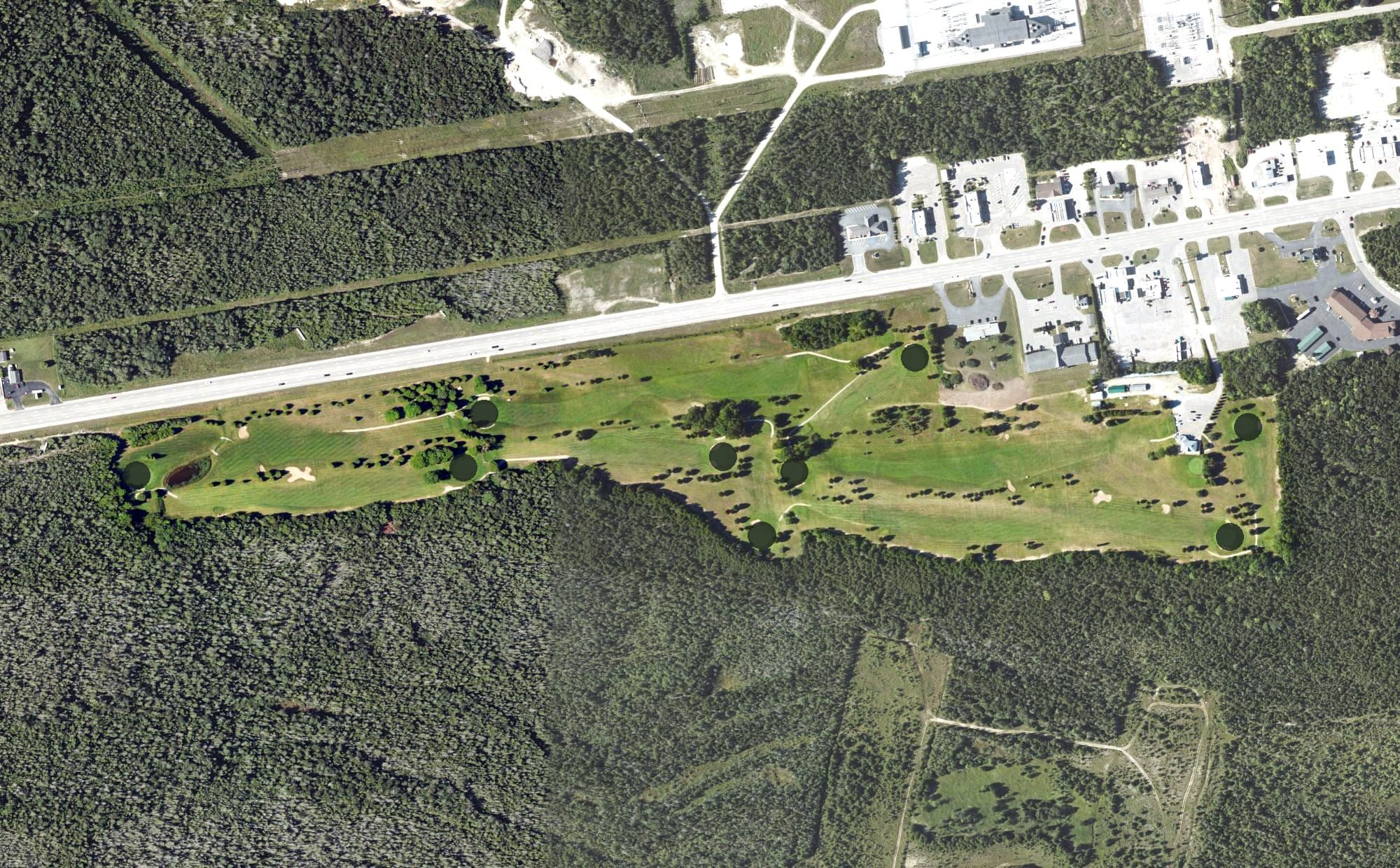 Aerial view of Saint Ignace Golf & Country Club, MI, with its hole routing marked