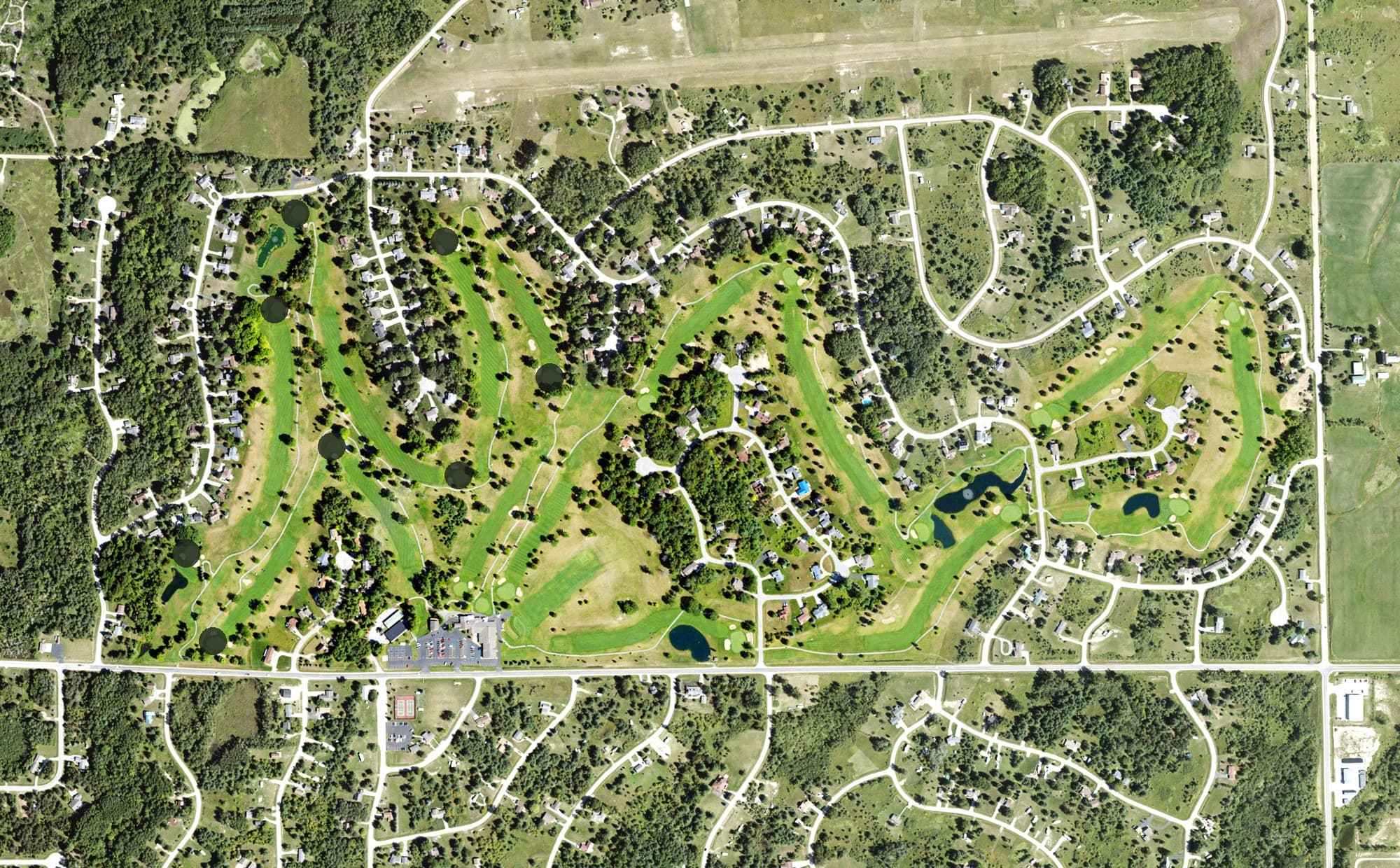 Aerial view of Sugar Springs Golf Club, MI, with its hole routing marked