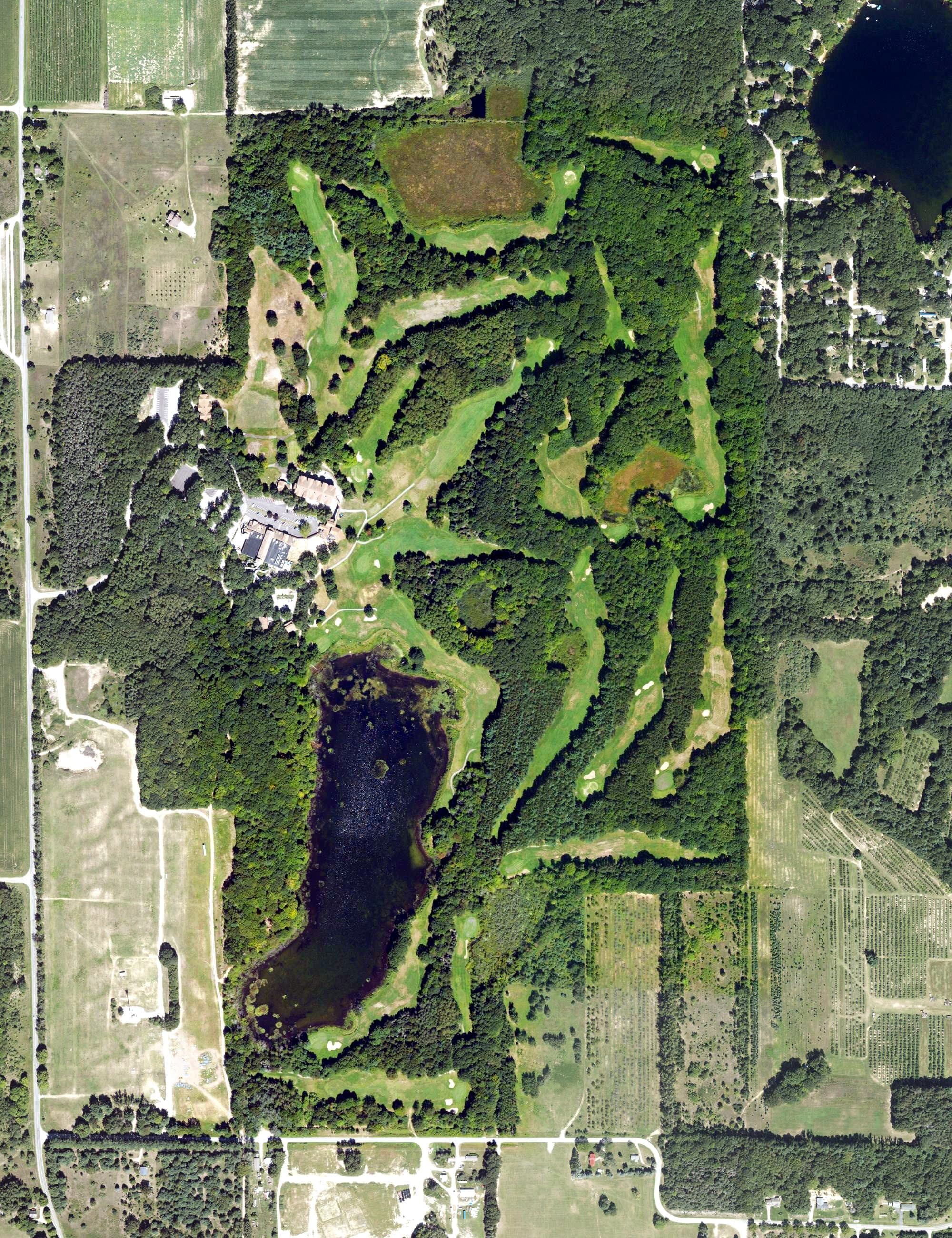 Aerial view of Thoroughbred Golf Club, MI, with its hole routing marked