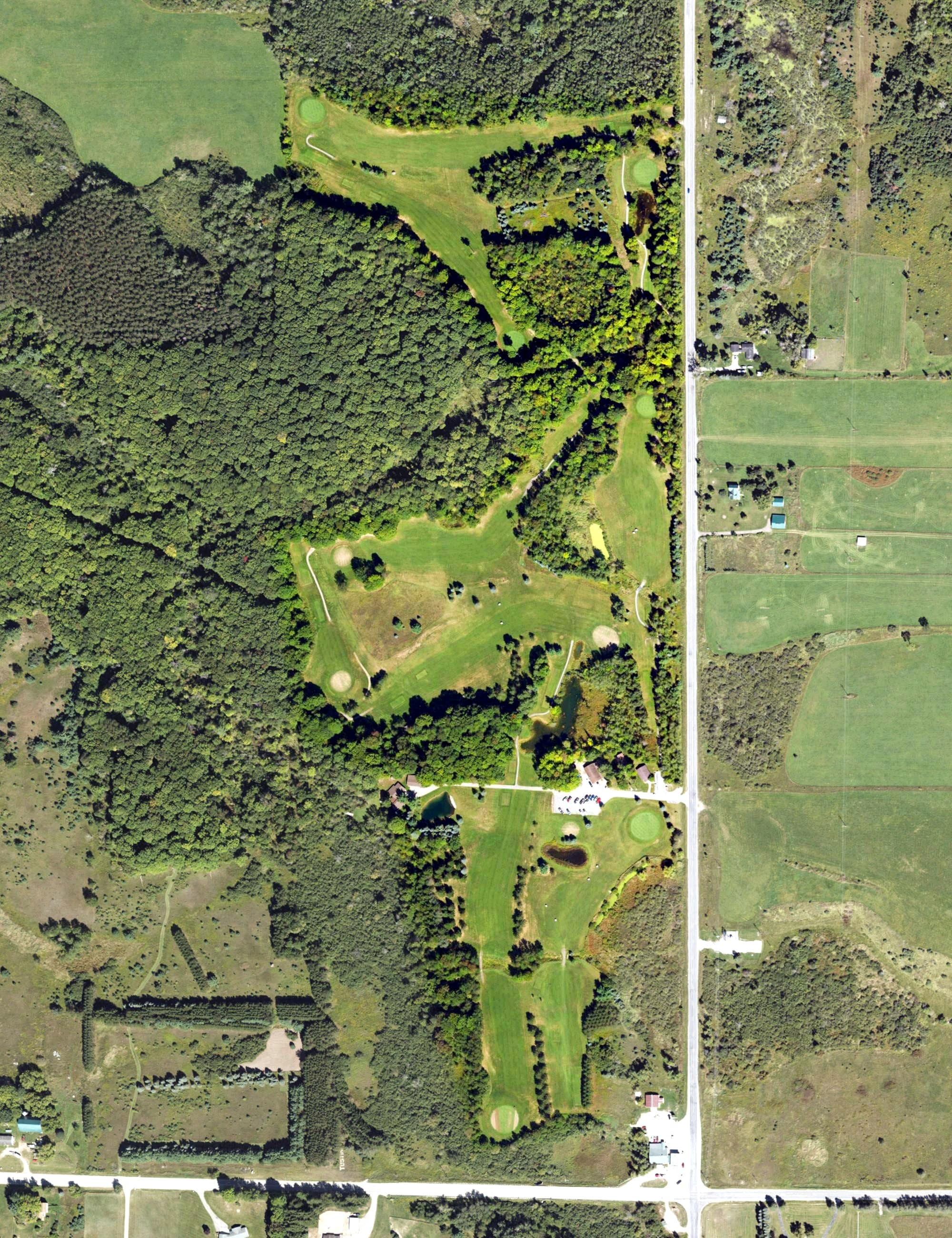 Aerial view of Tustin Trails Golf Course, MI, with its hole routing marked