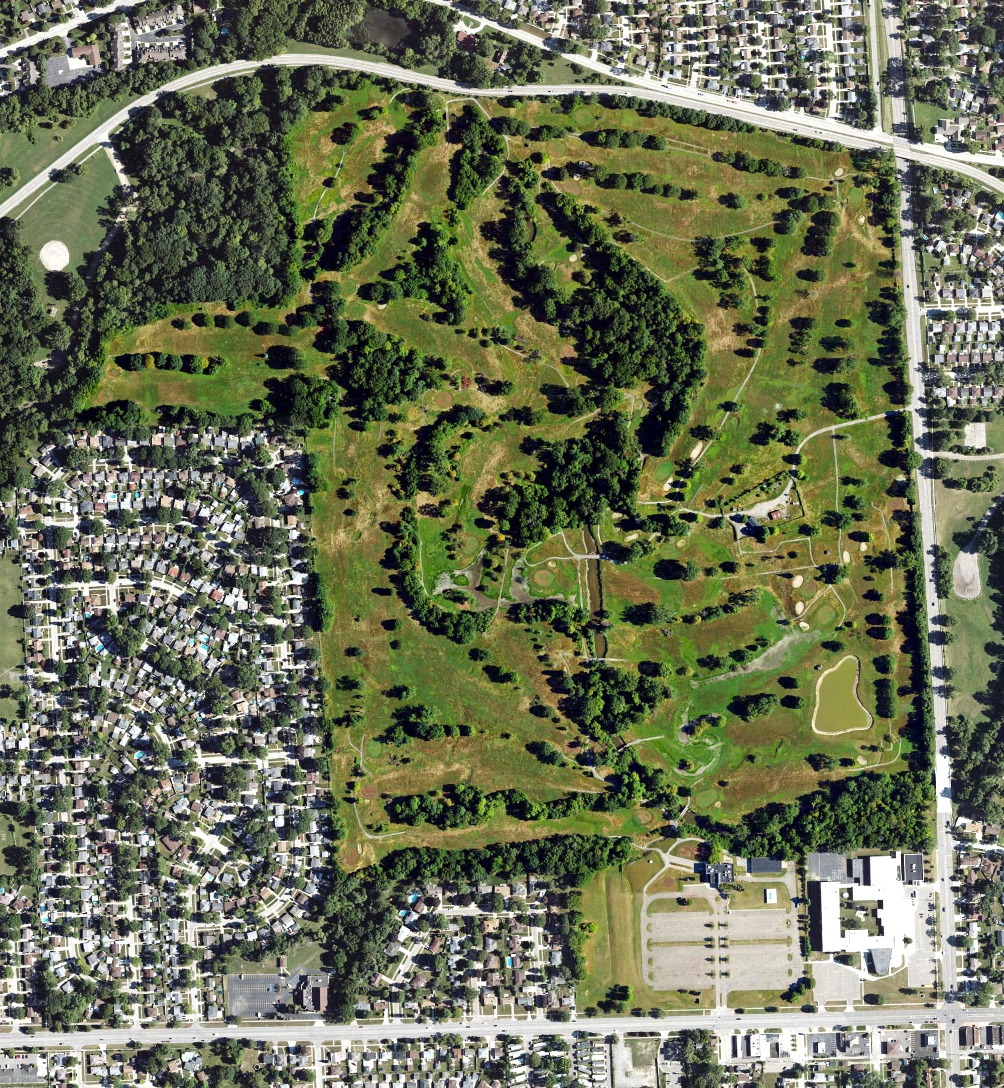 Aerial view of Warren Valley Golf Course, MI, with its hole routing marked