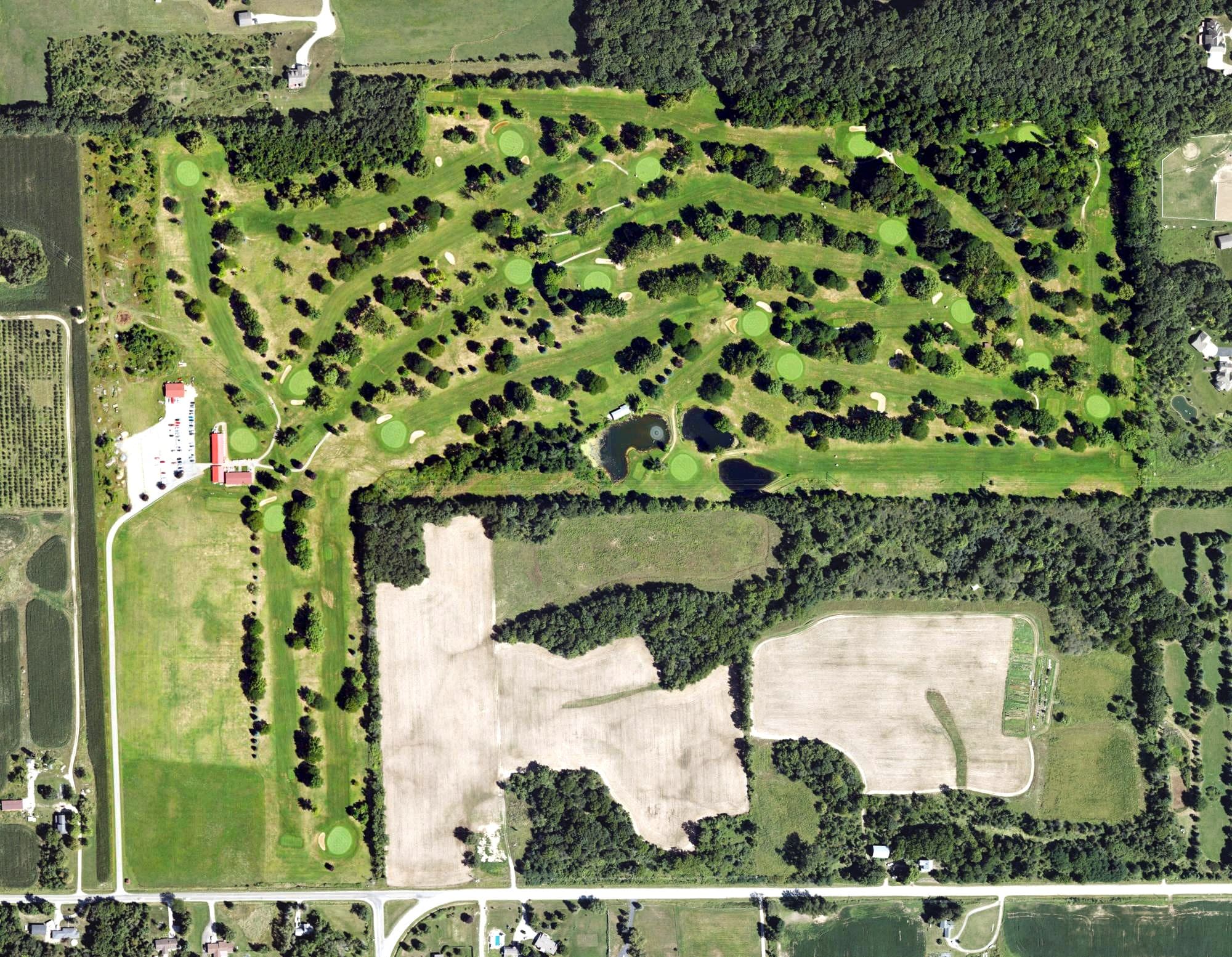 Aerial view of Western Greens Country Club, MI, with its hole routing marked