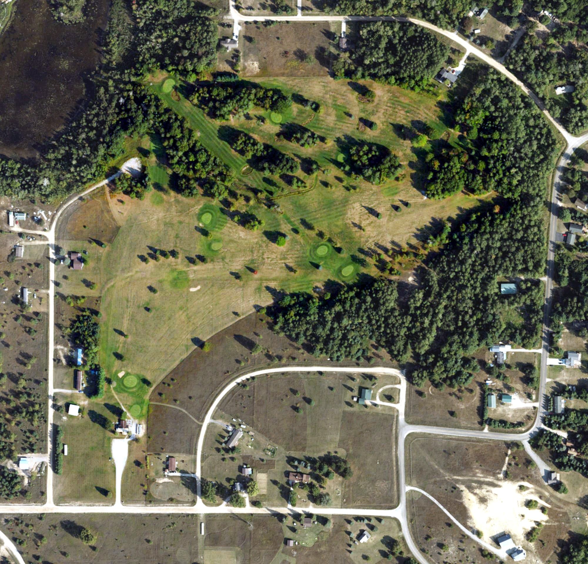 Aerial view of Wildwood Lake Golf Course, MI, with its hole routing marked