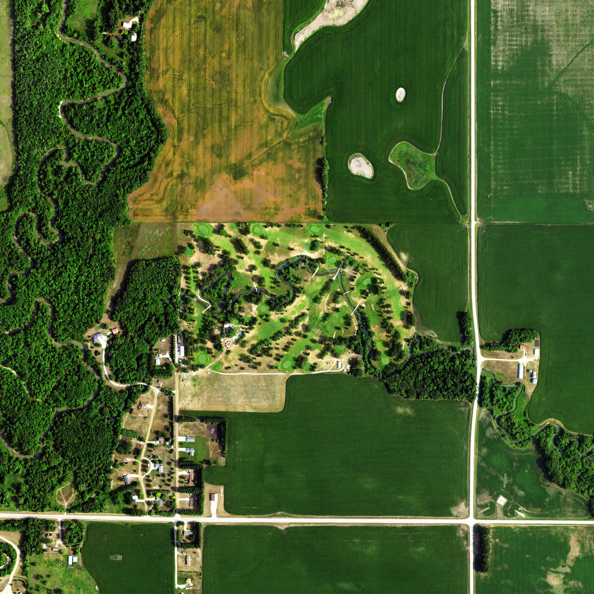Aerial view of Mahnomen County Country Club, MN, with its hole routing marked