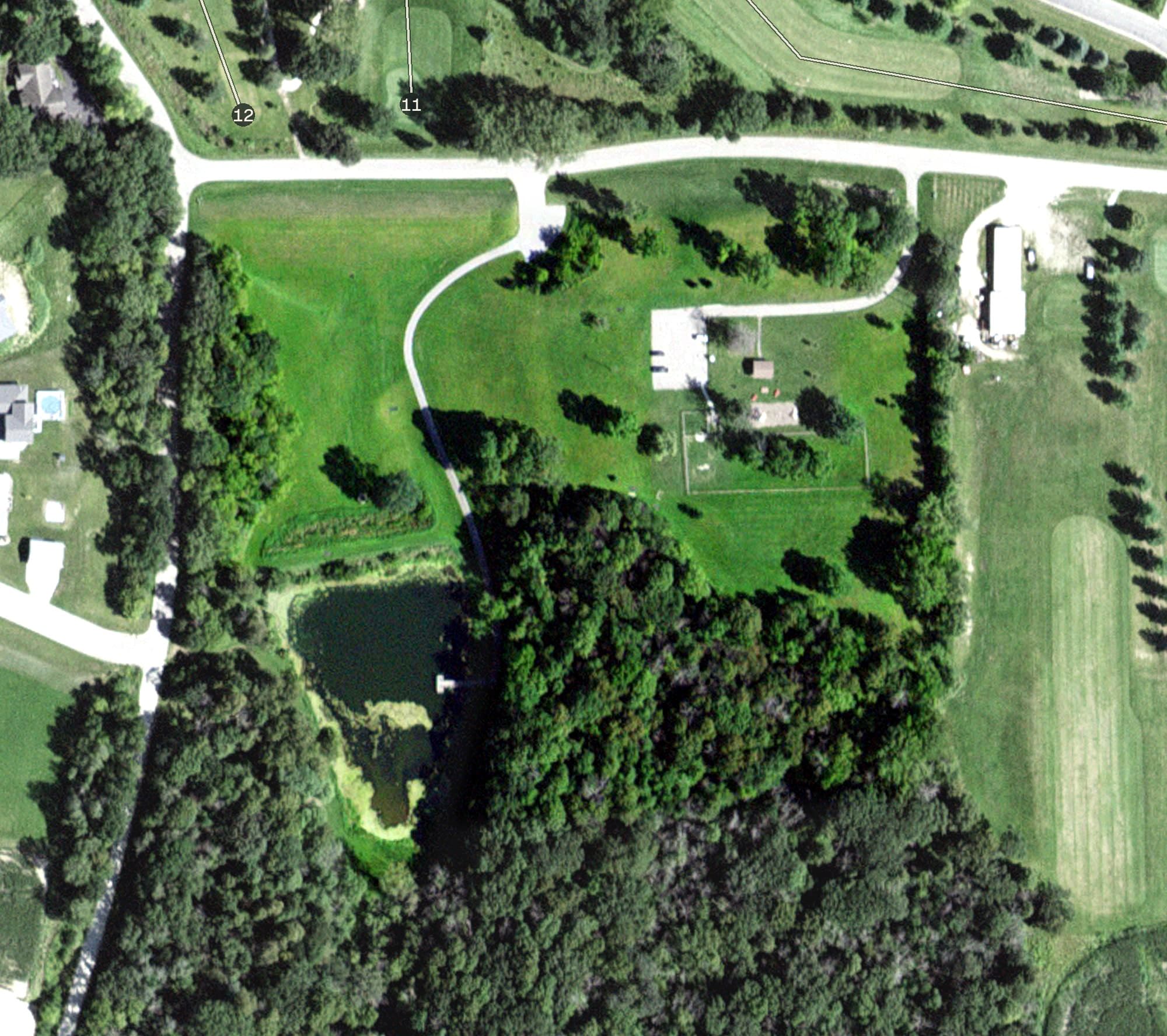 Aerial view of St. Charles Disc Golf Course, MN, with its hole routing marked