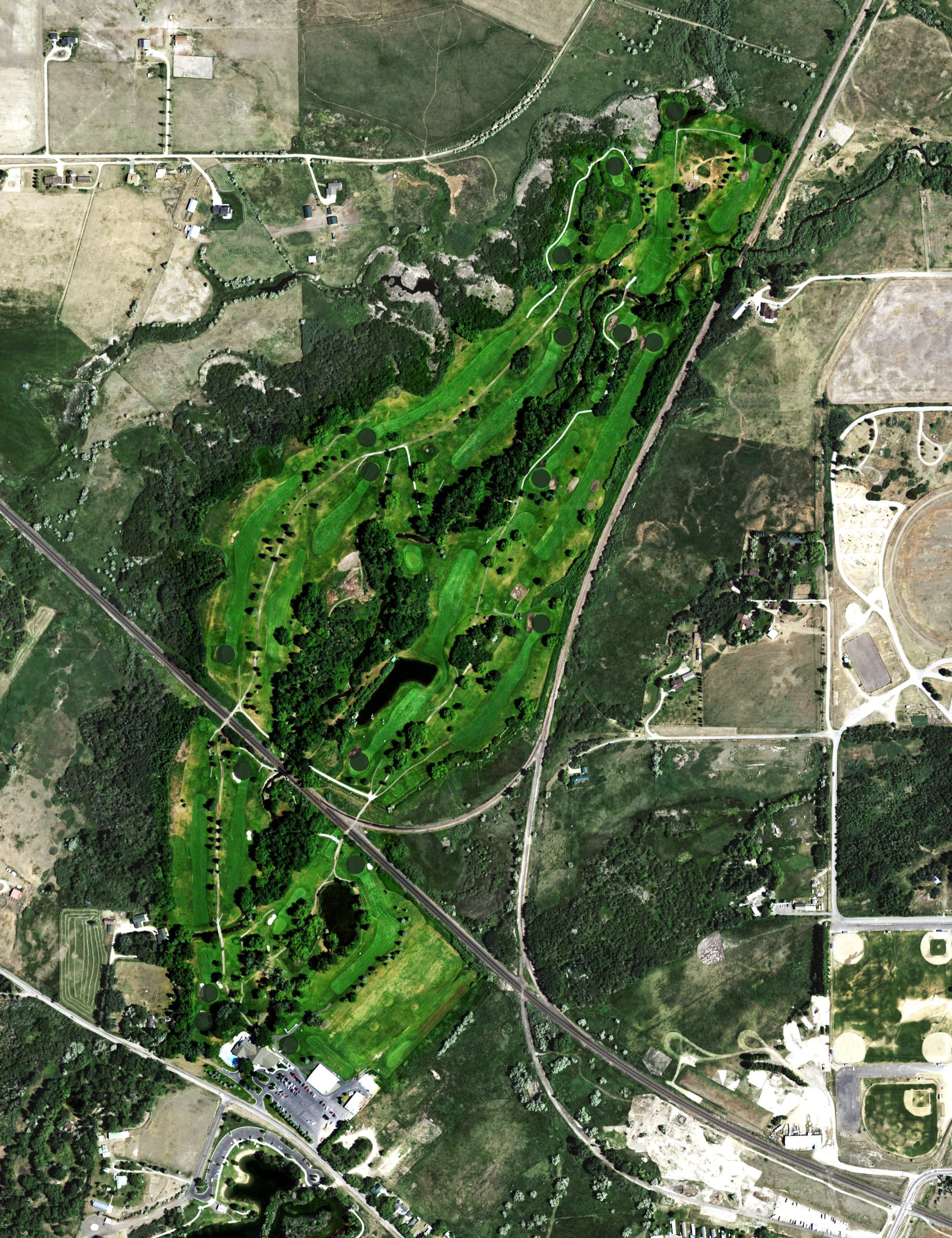 Aerial view of Green Meadow Country Club, MT, with its hole routing marked