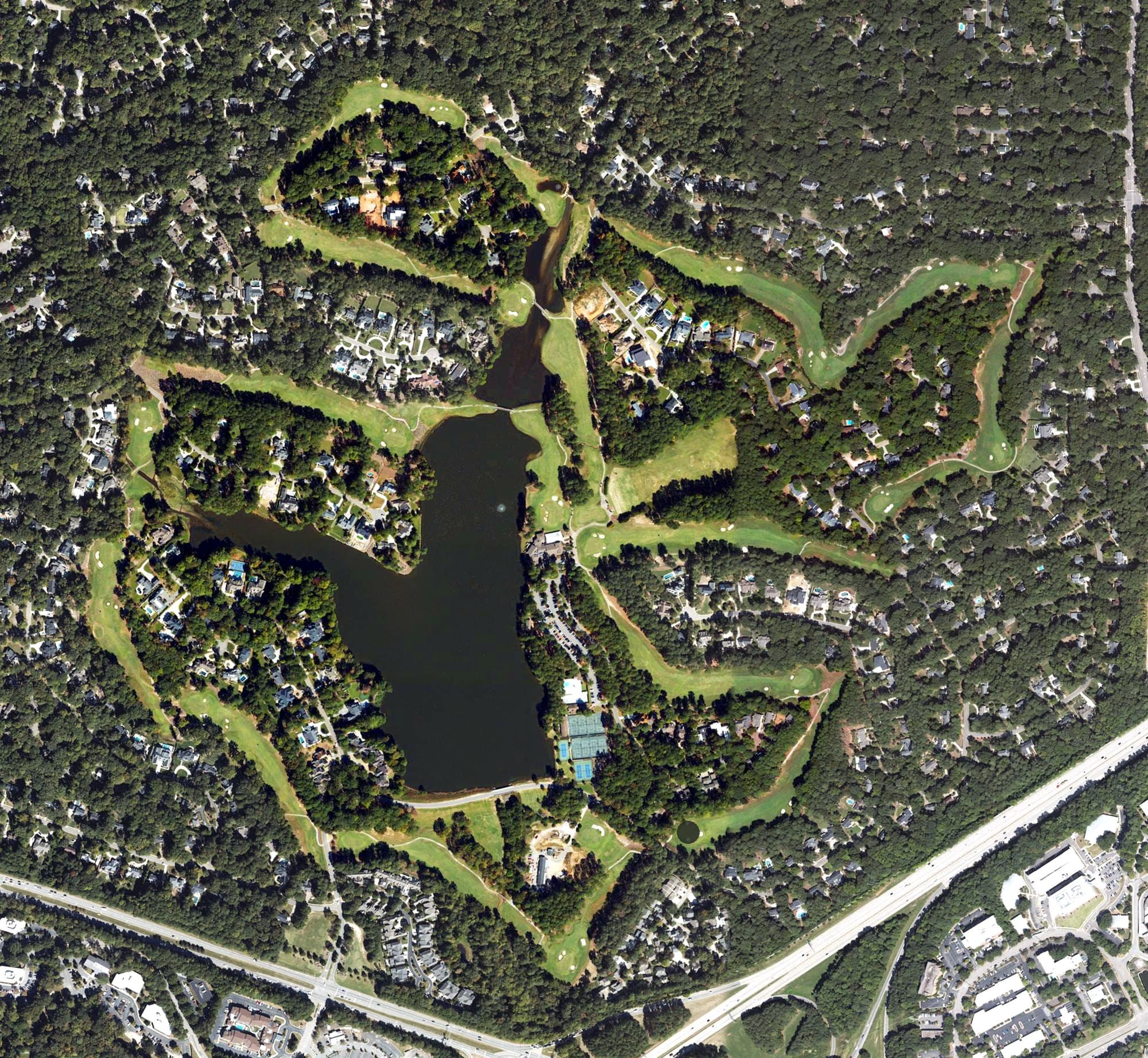 Aerial view of MacGregor Downs Country Club, NC, with its hole routing marked