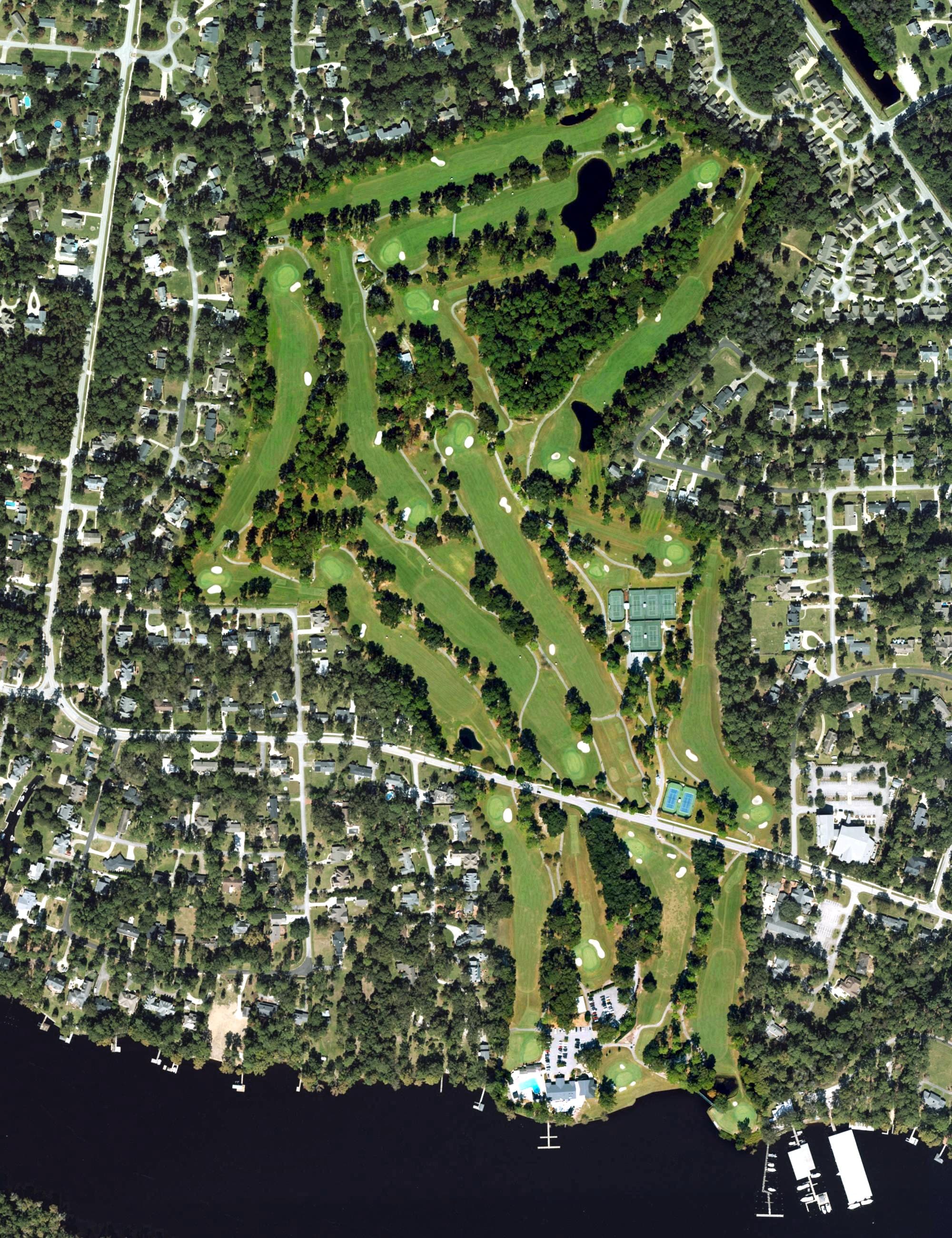 Aerial view of New Bern Golf & Country Club, NC, with its hole routing marked