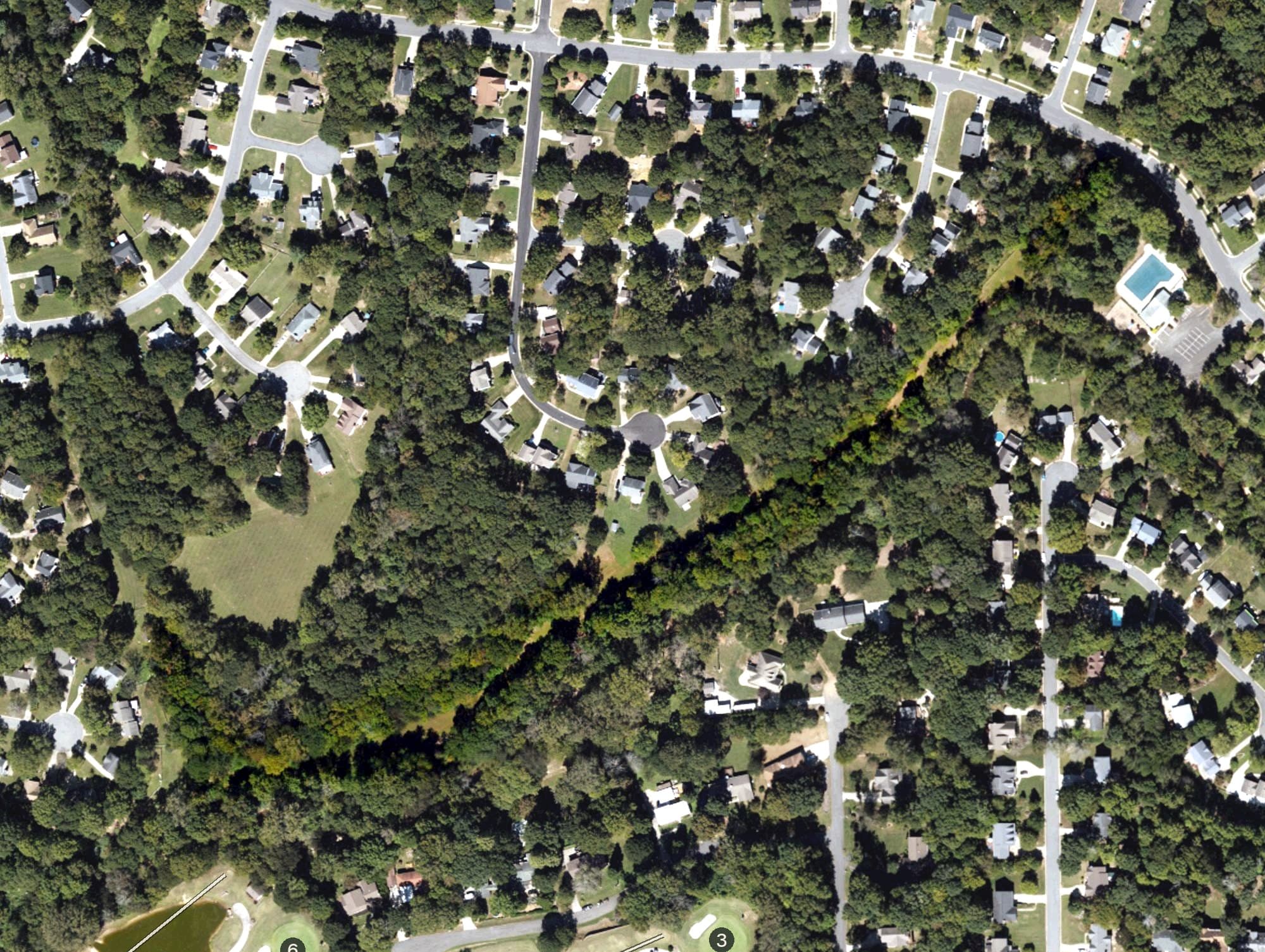 Aerial view of Northwoods Disc Golf Course, NC, with its hole routing marked