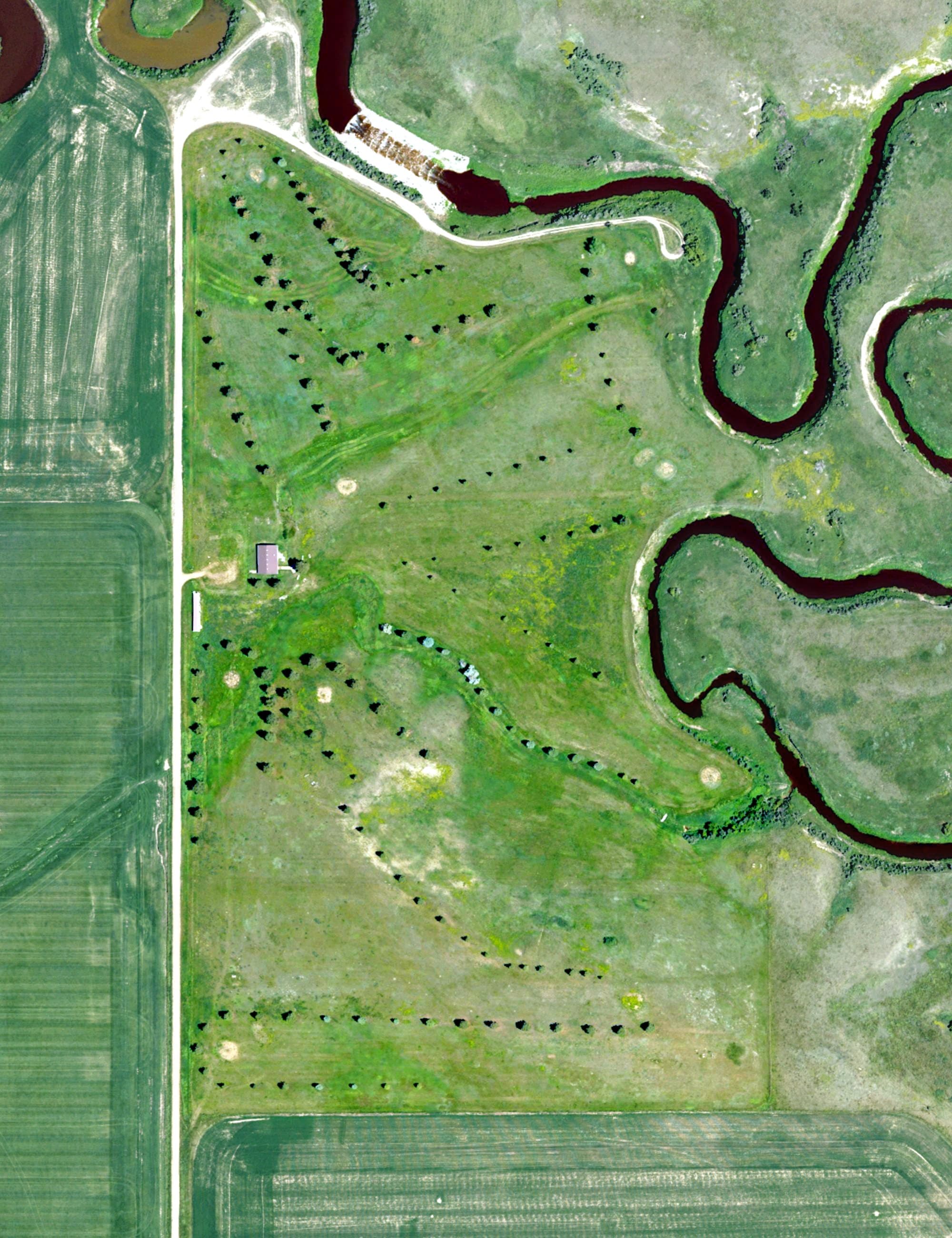 Aerial view of New England Golf Course, ND, with its hole routing marked