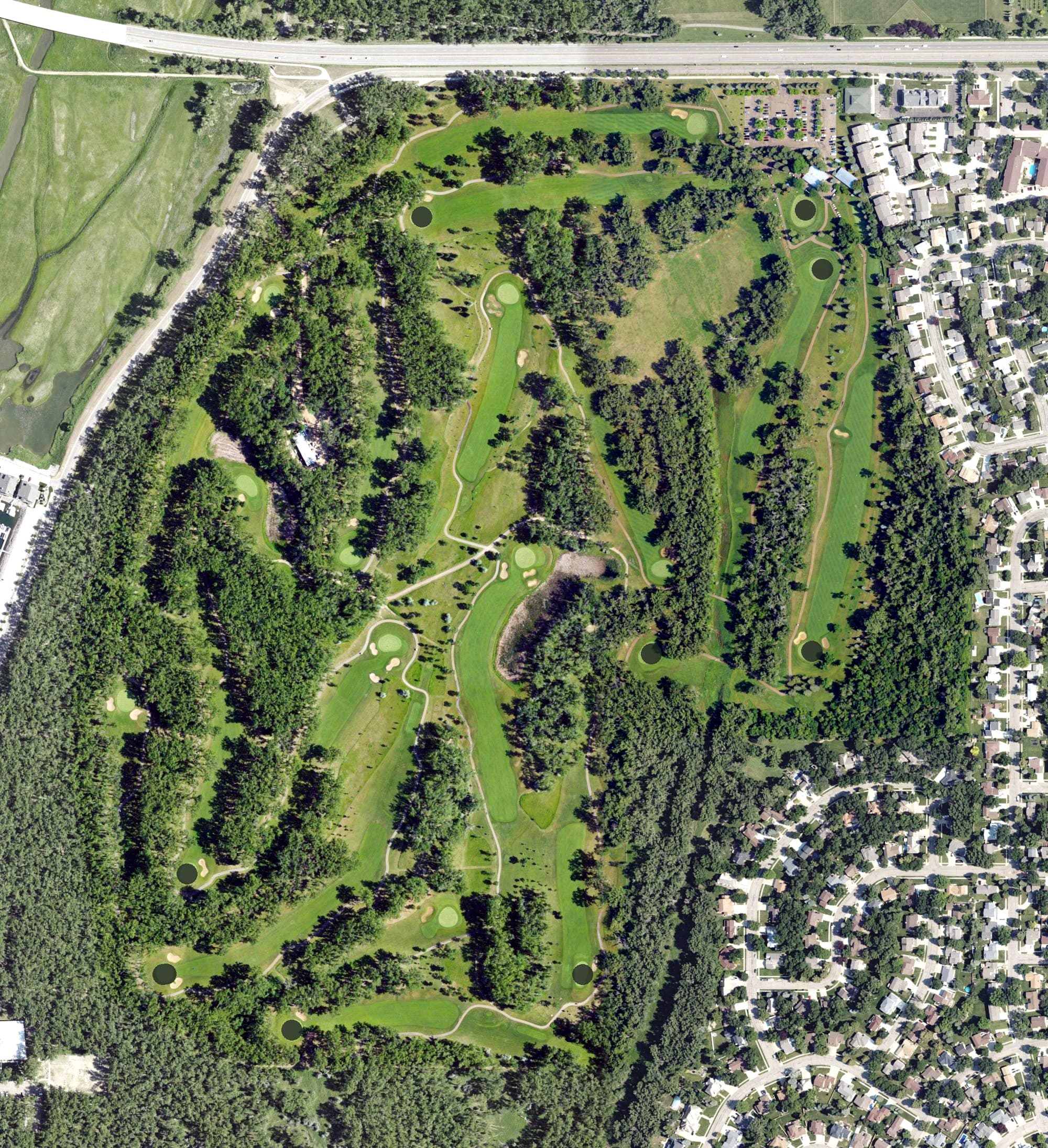 Aerial view of Riverwood Golf Course, ND, with its hole routing marked