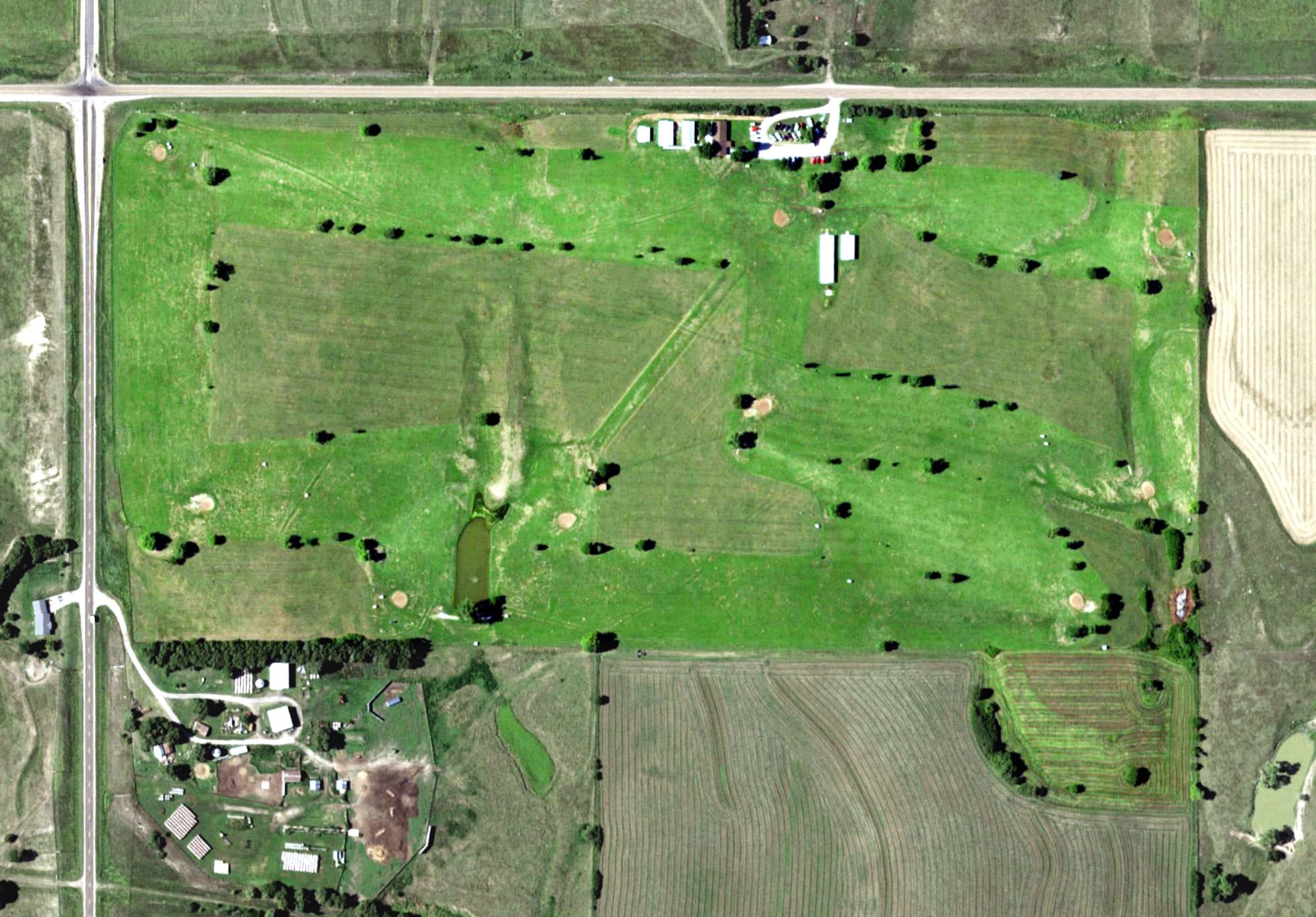 Aerial view of Lawrence Country Club, NE, with its hole routing marked