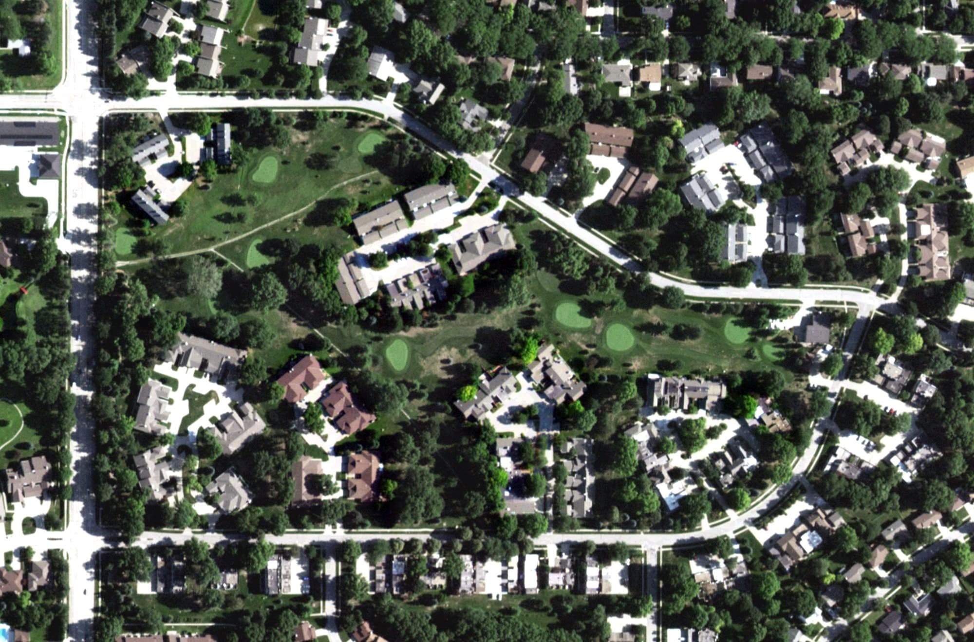 Aerial view of Wellington Greens Golf Course, NE, with its hole routing marked