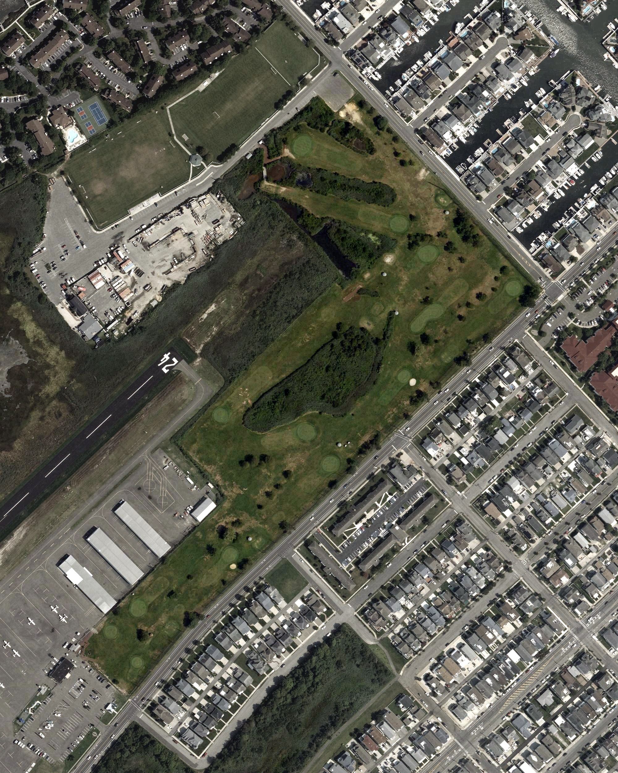 Aerial view of Ocean City Golf Course, NJ, with its hole routing marked