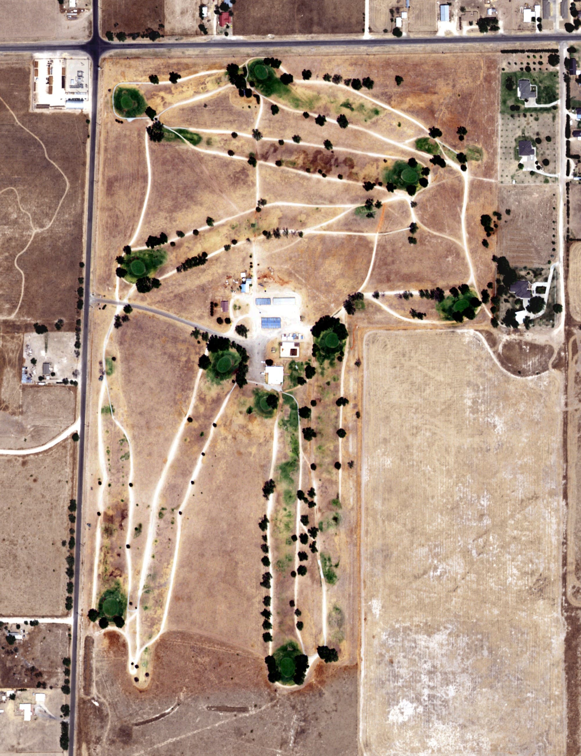 Aerial view of Portales Country Club, NM, with its hole routing marked