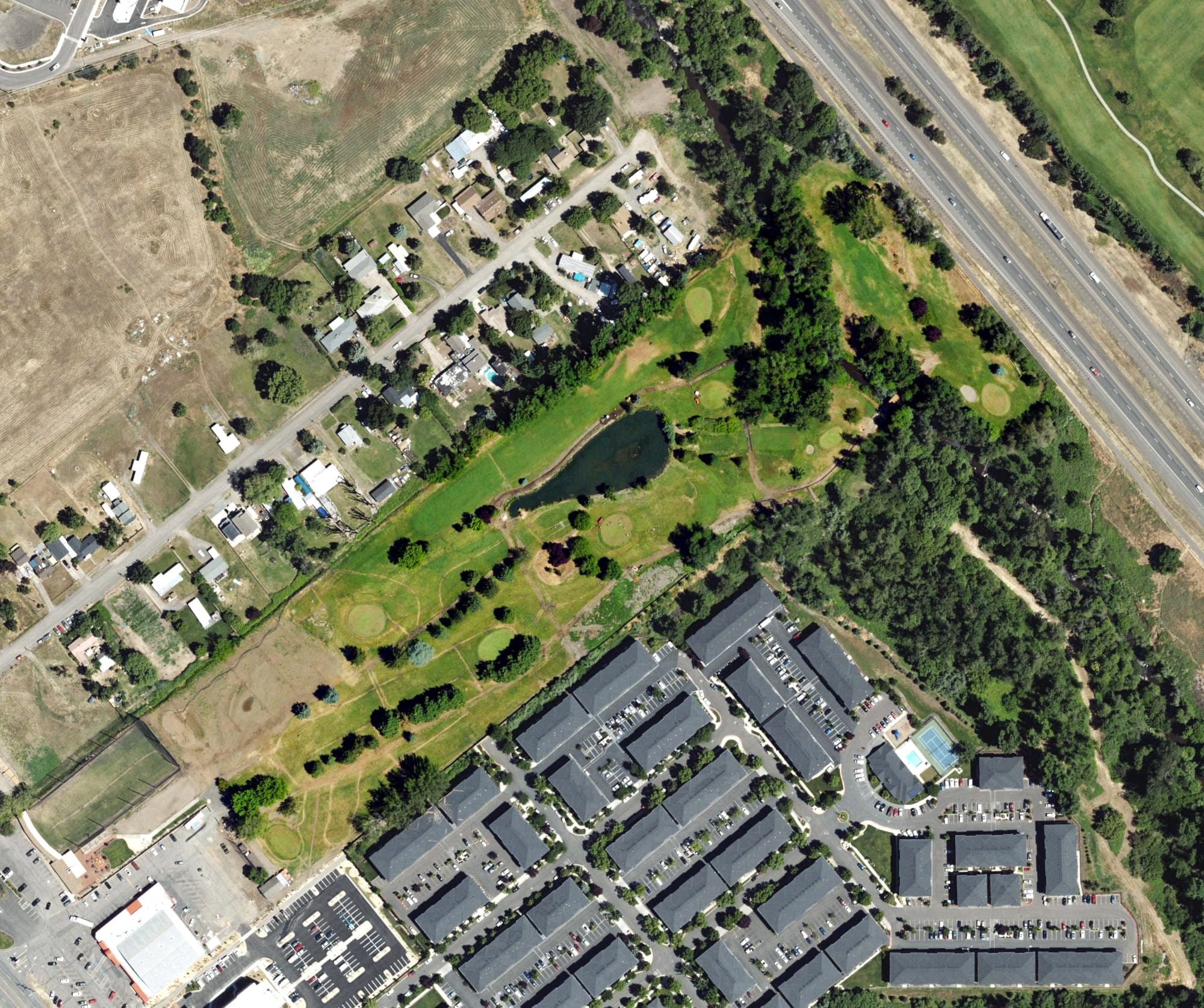 Aerial view of Bear Creek Golf Course, OR, with its hole routing marked