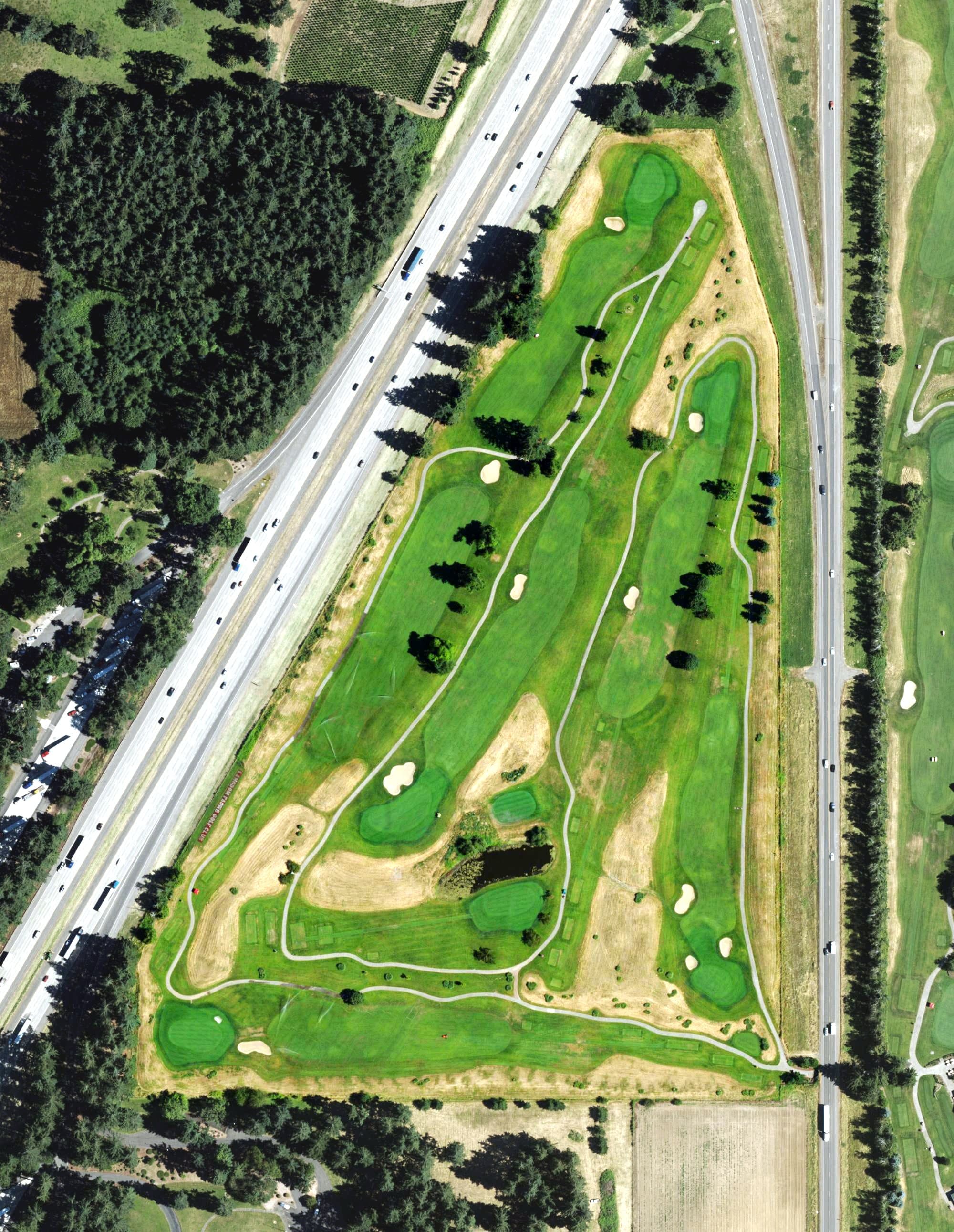 Aerial view of Langdon Farms Golf Course, OR, with its hole routing marked