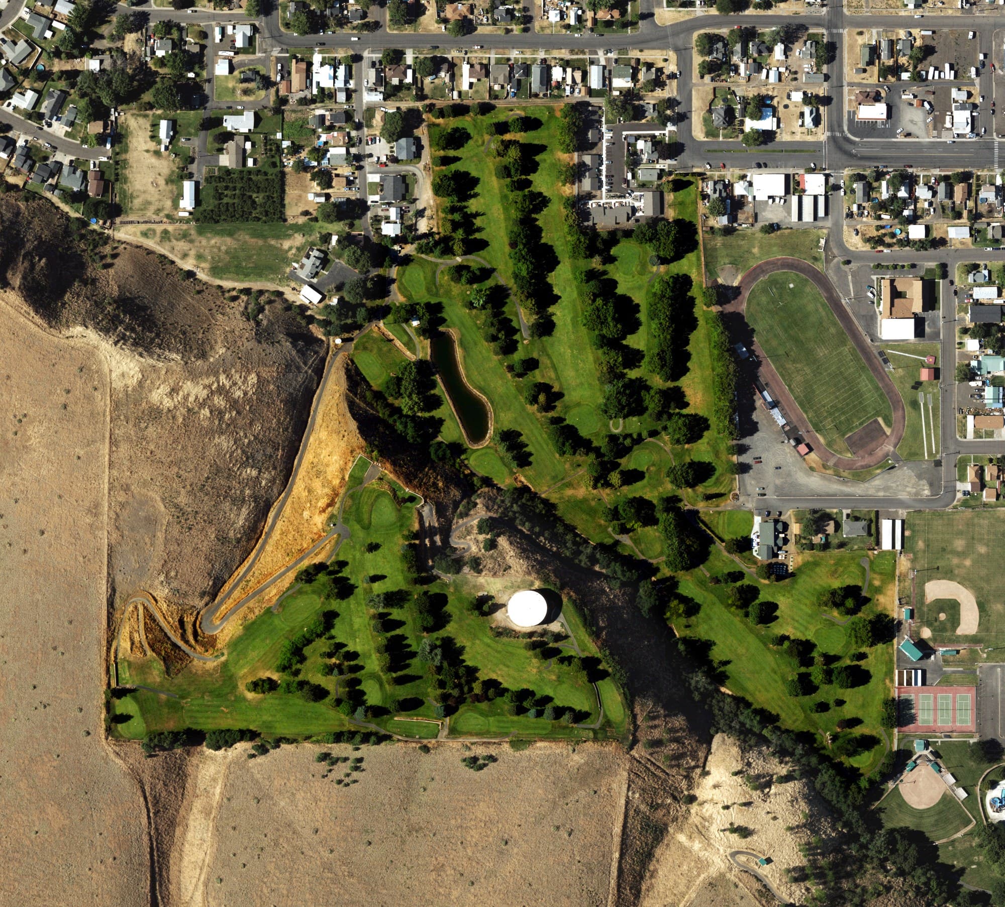 Aerial view of Milton-Freewater Municipal Golf Course, OR, with its hole routing marked
