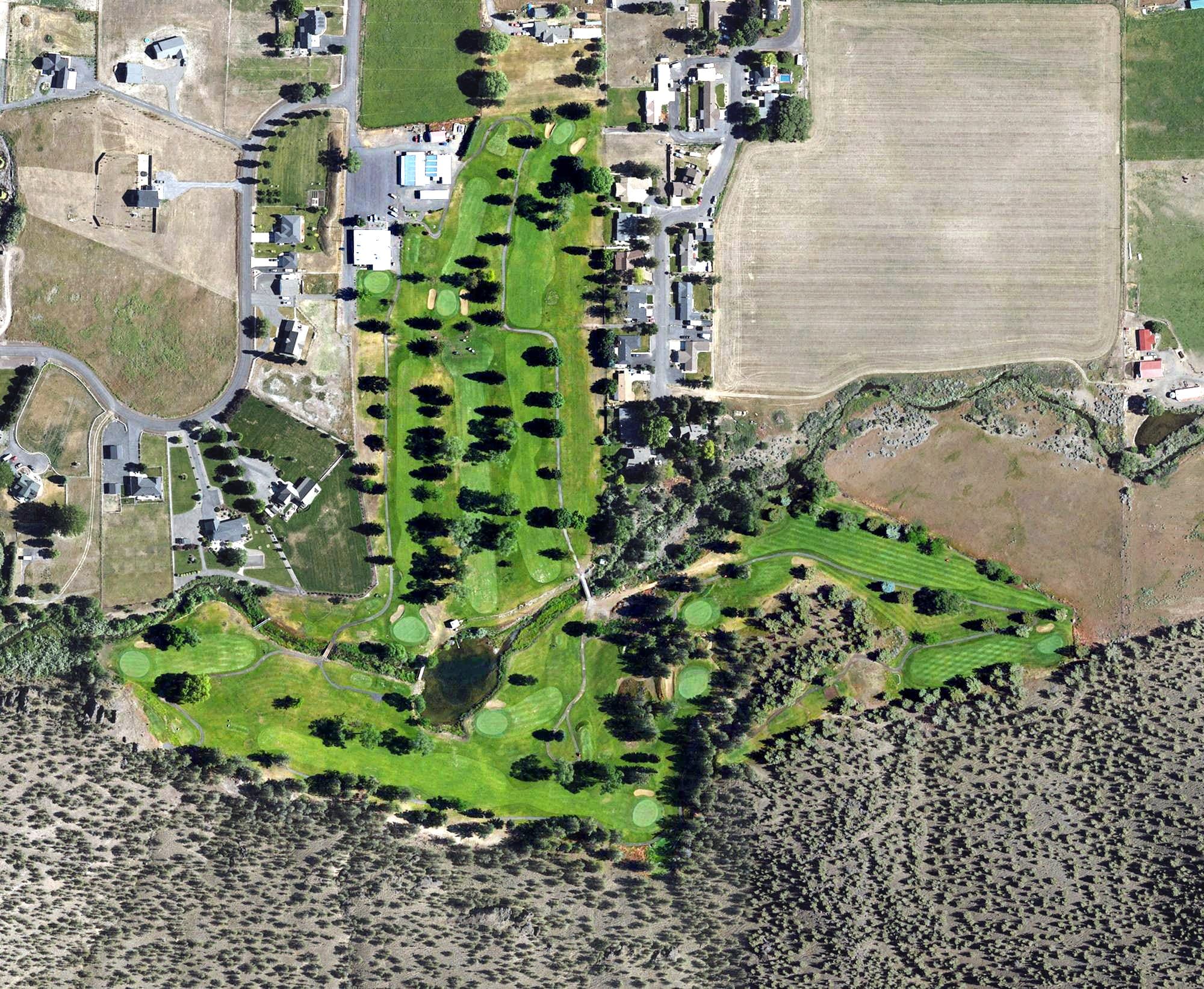 Aerial view of Prineville Golf and Country Clup, OR, with its hole routing marked