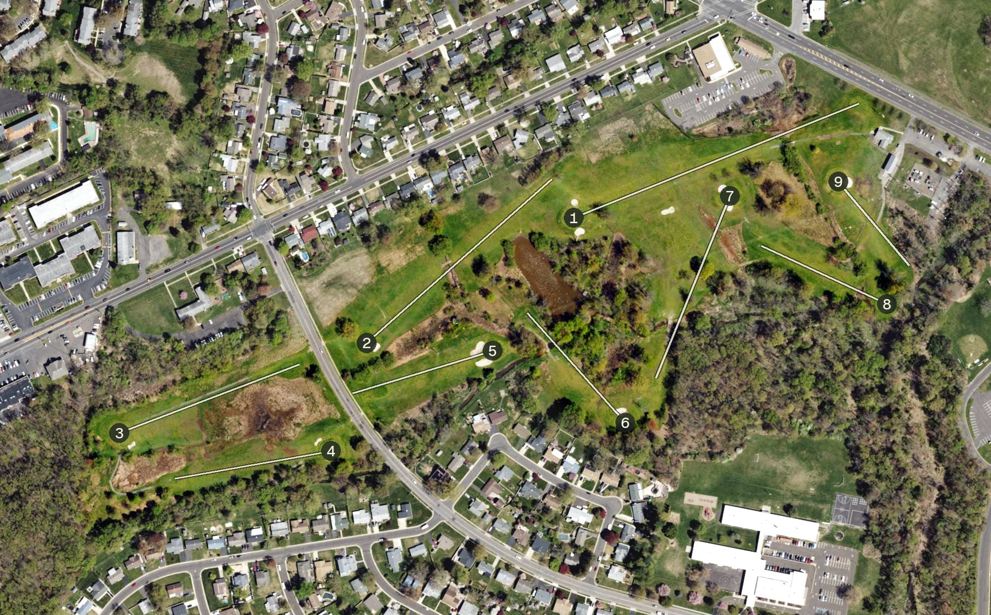 Aerial view of Oxford Valley Public Golf Course, PA, with its hole routing marked
