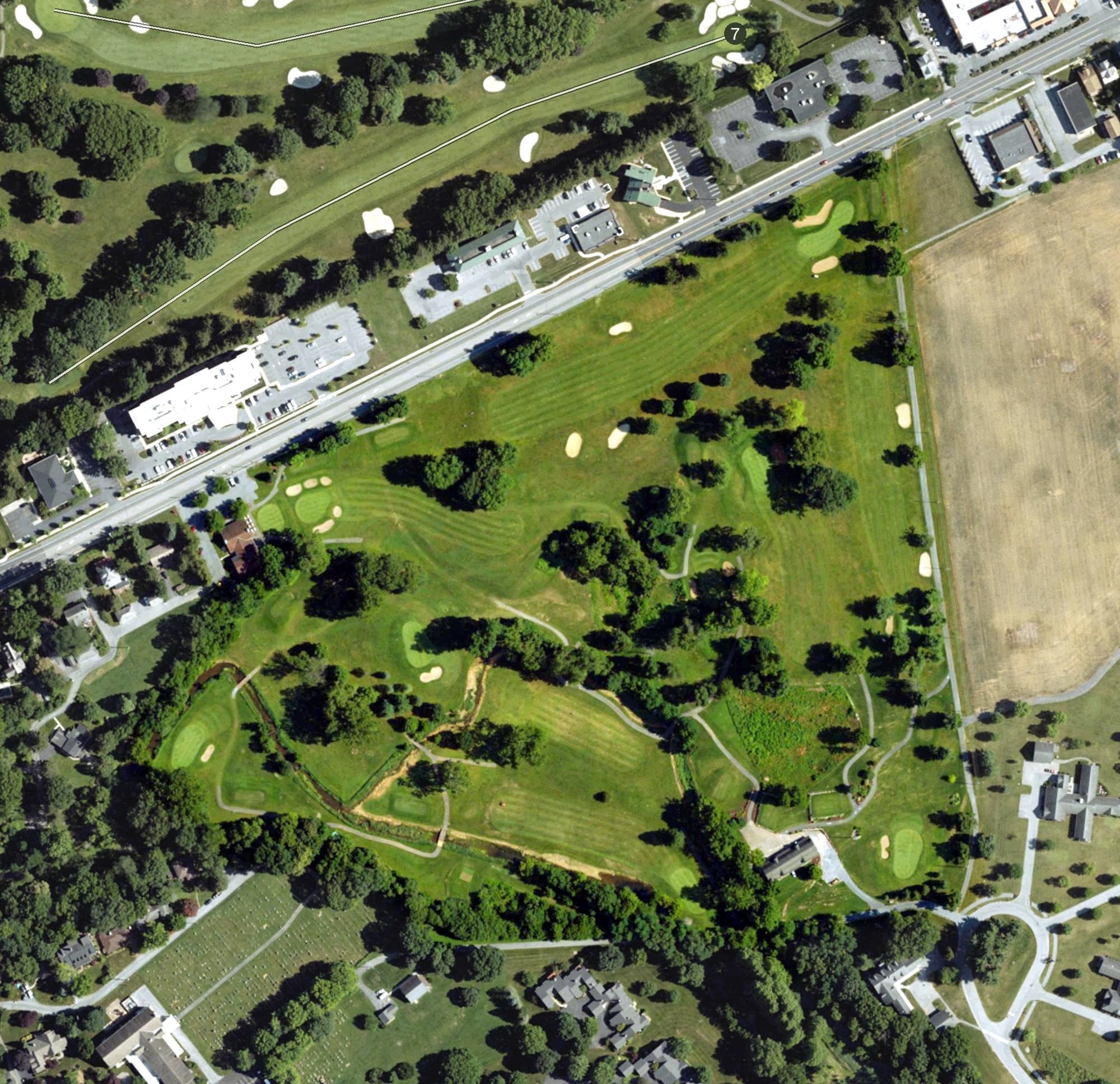 Aerial view of Spring Creek Golf Course, PA, with its hole routing marked