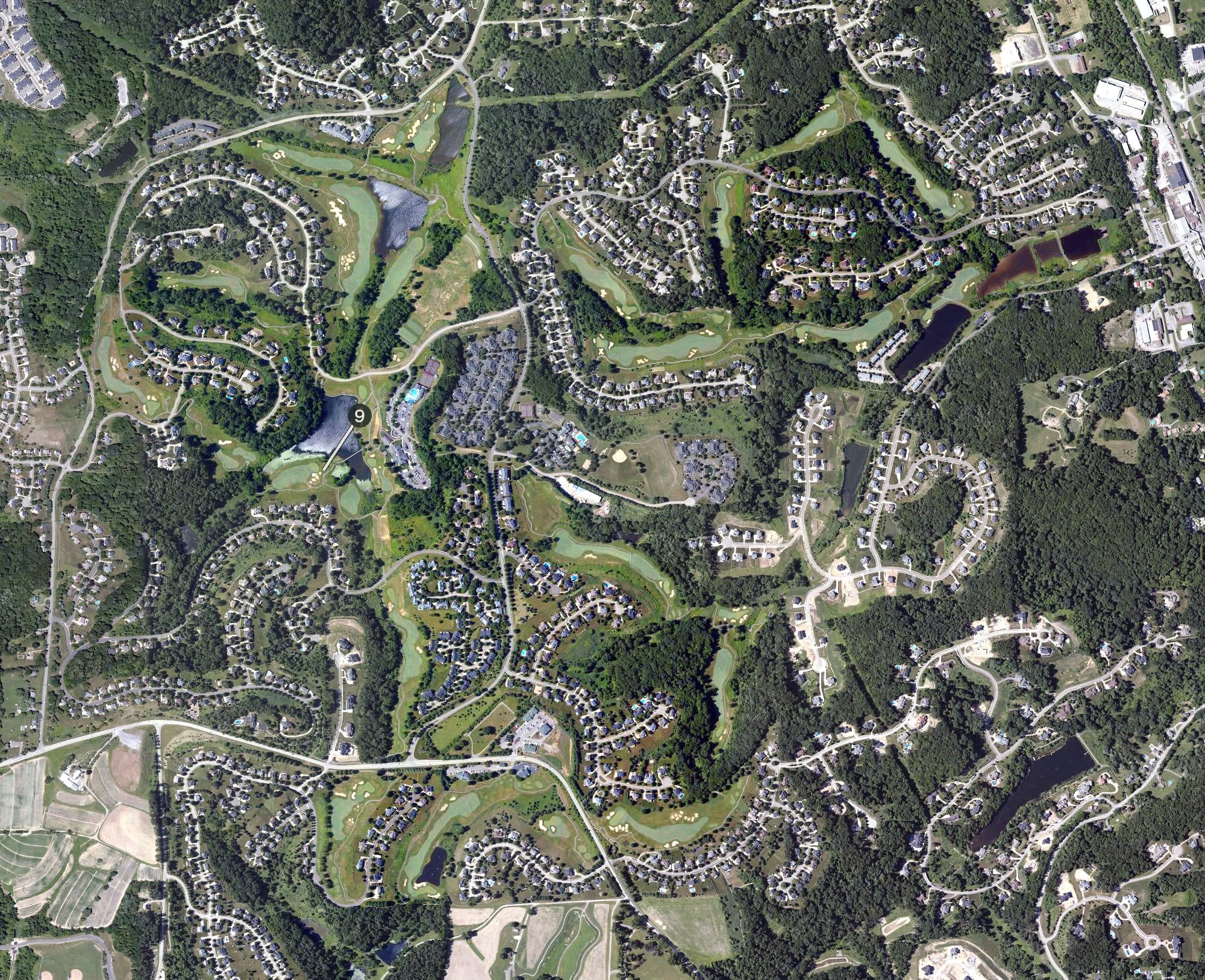 Aerial view of Treesdale Golf and Country Club, PA, with its hole routing marked