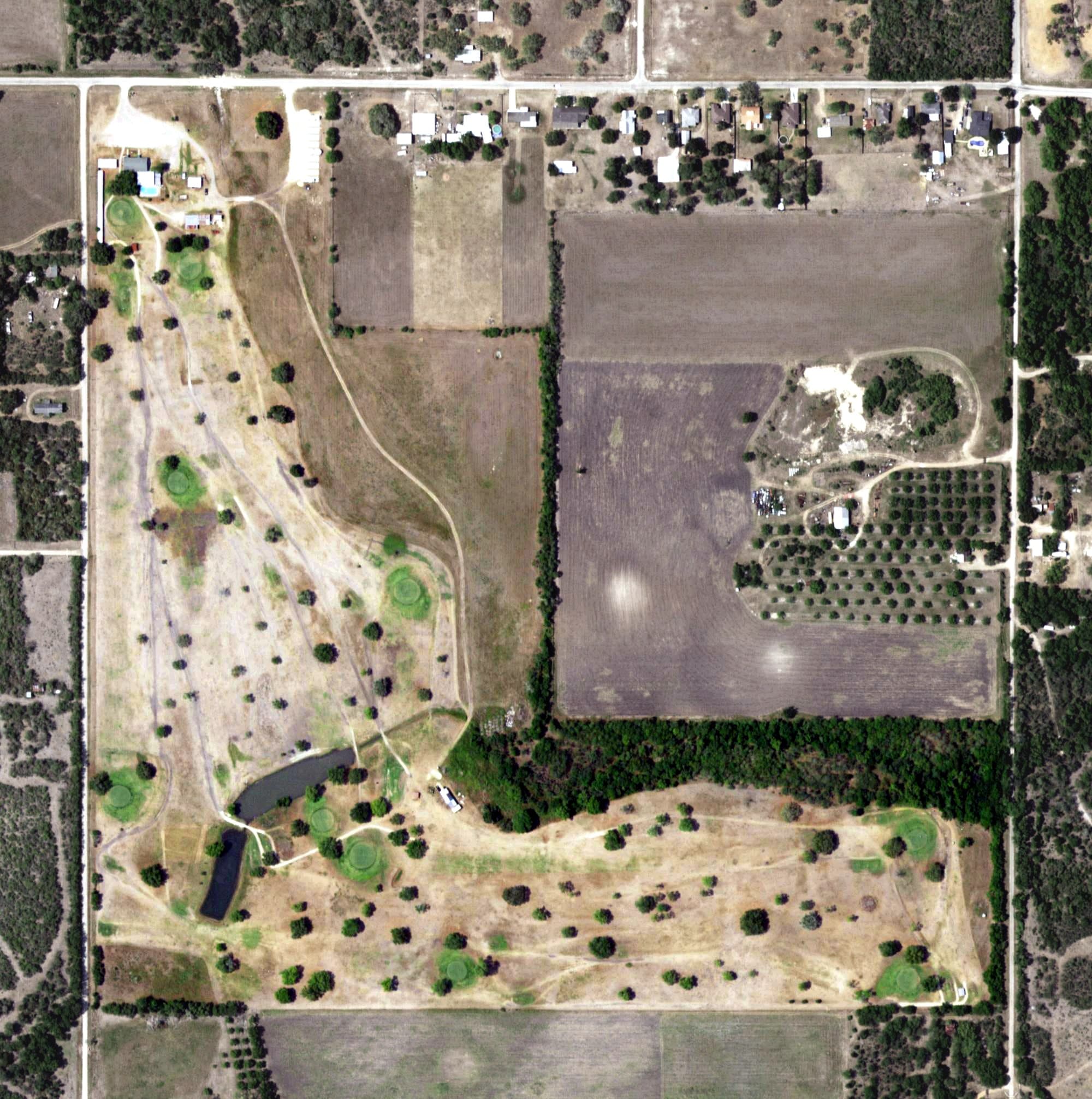 Aerial view of Goliad Golf Club, TX, with its hole routing marked