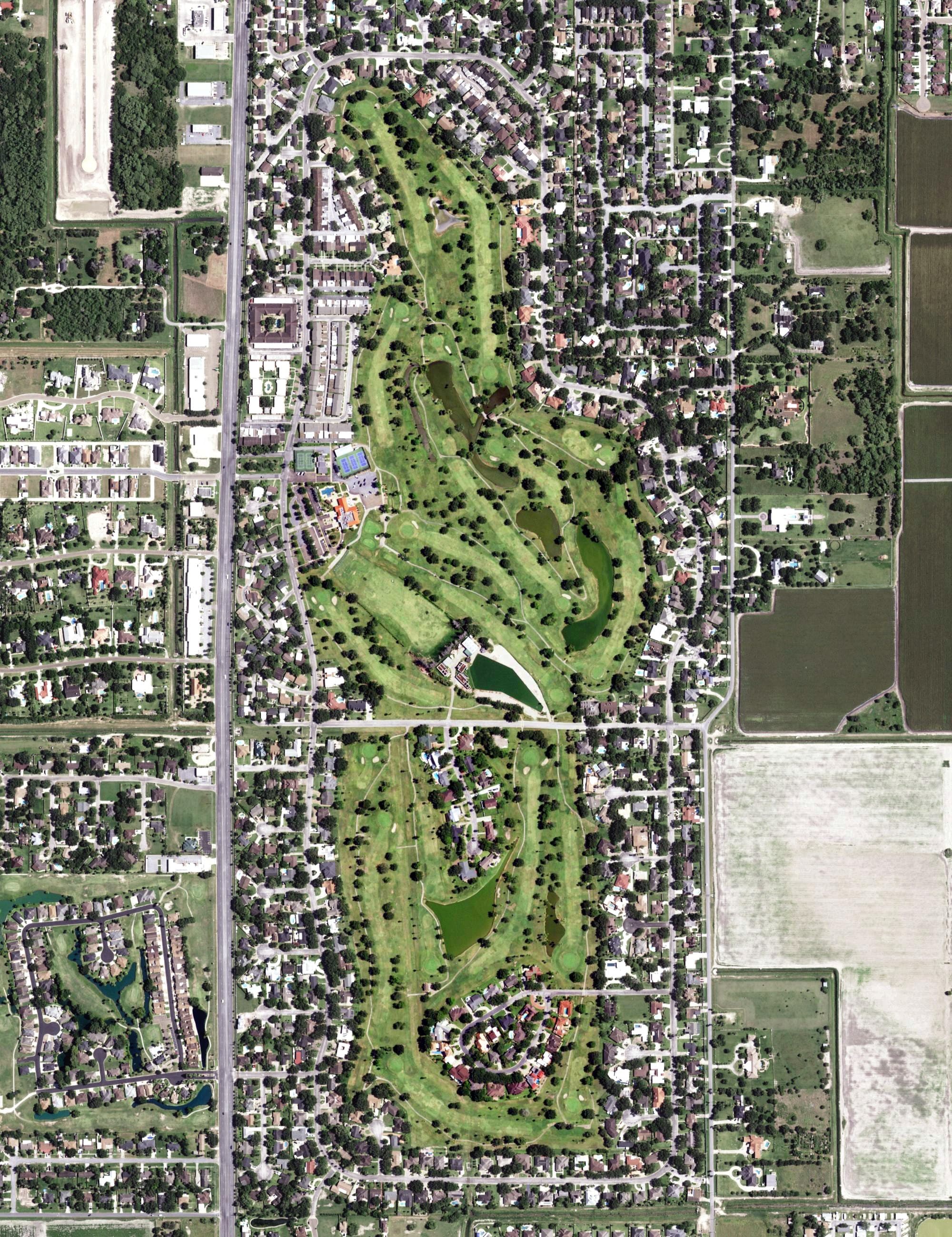 Aerial view of Harlingen Country Club, TX, with its hole routing marked