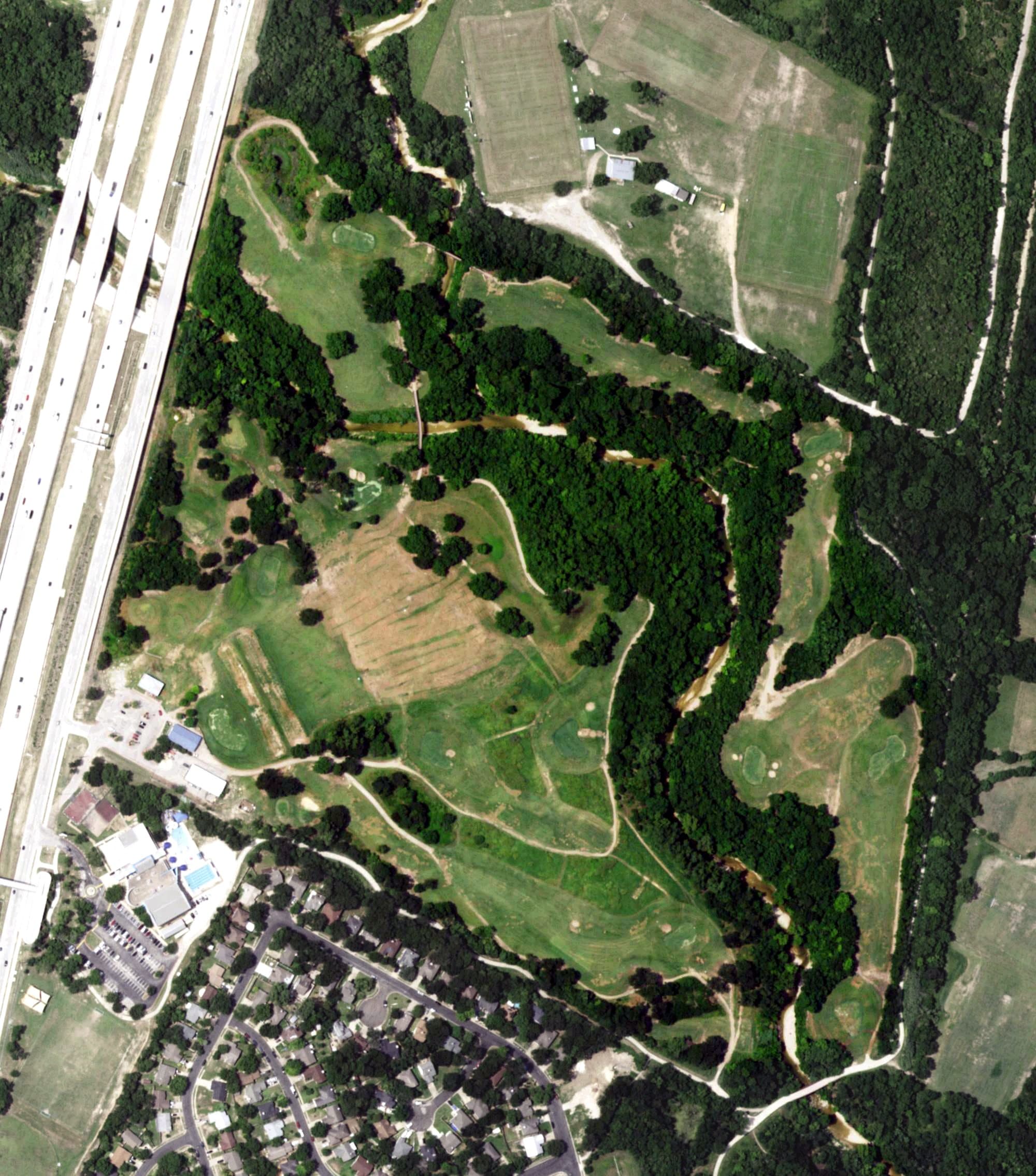 Aerial view of Harvey Penick Golf Campus, TX, with its hole routing marked