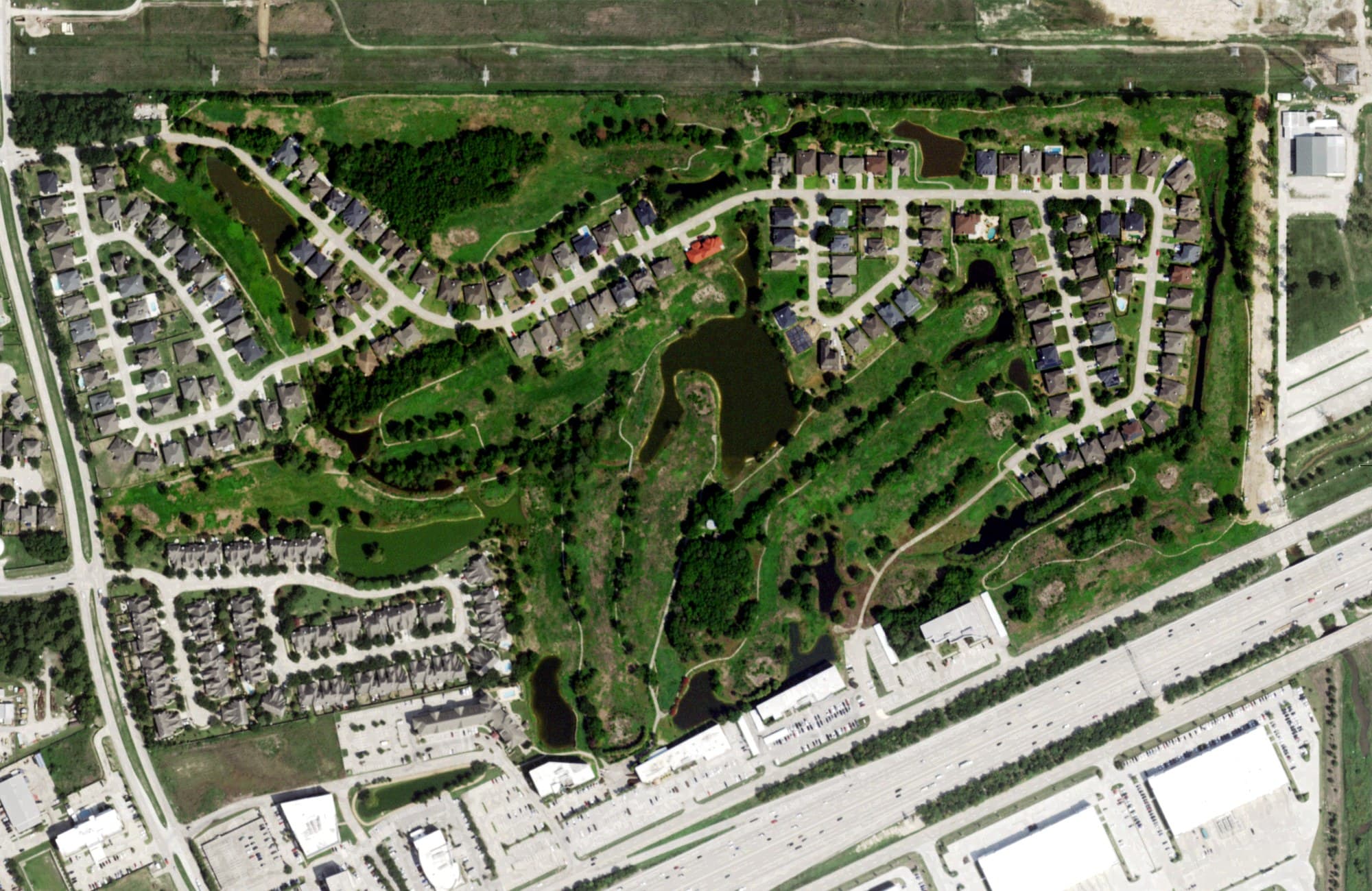 Aerial view of Heron Lakes Golf Course, TX, with its hole routing marked