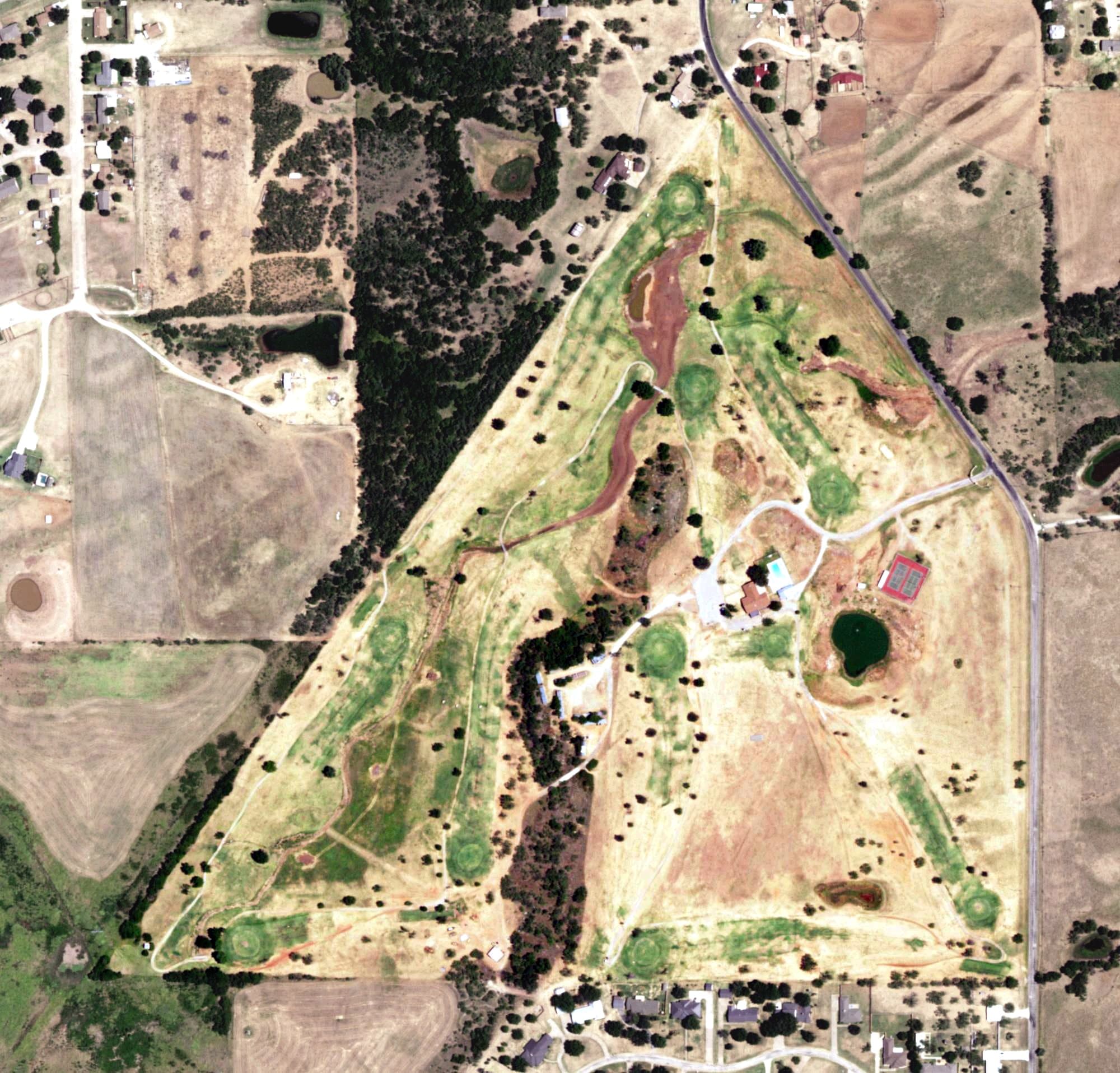 Aerial view of Olney Country Club, TX, with its hole routing marked